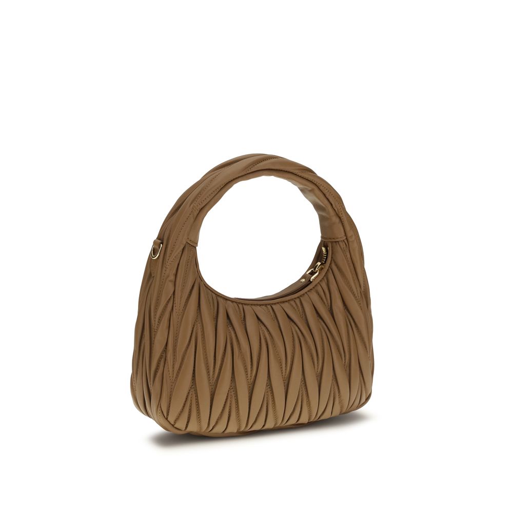 Elevate your style with the Miu Miu Beige Lamb Ovis Aries Aries Shoulder Bag, a luxurious blend of exquisite craftsmanship and timeless elegance, perfect for any occasion.