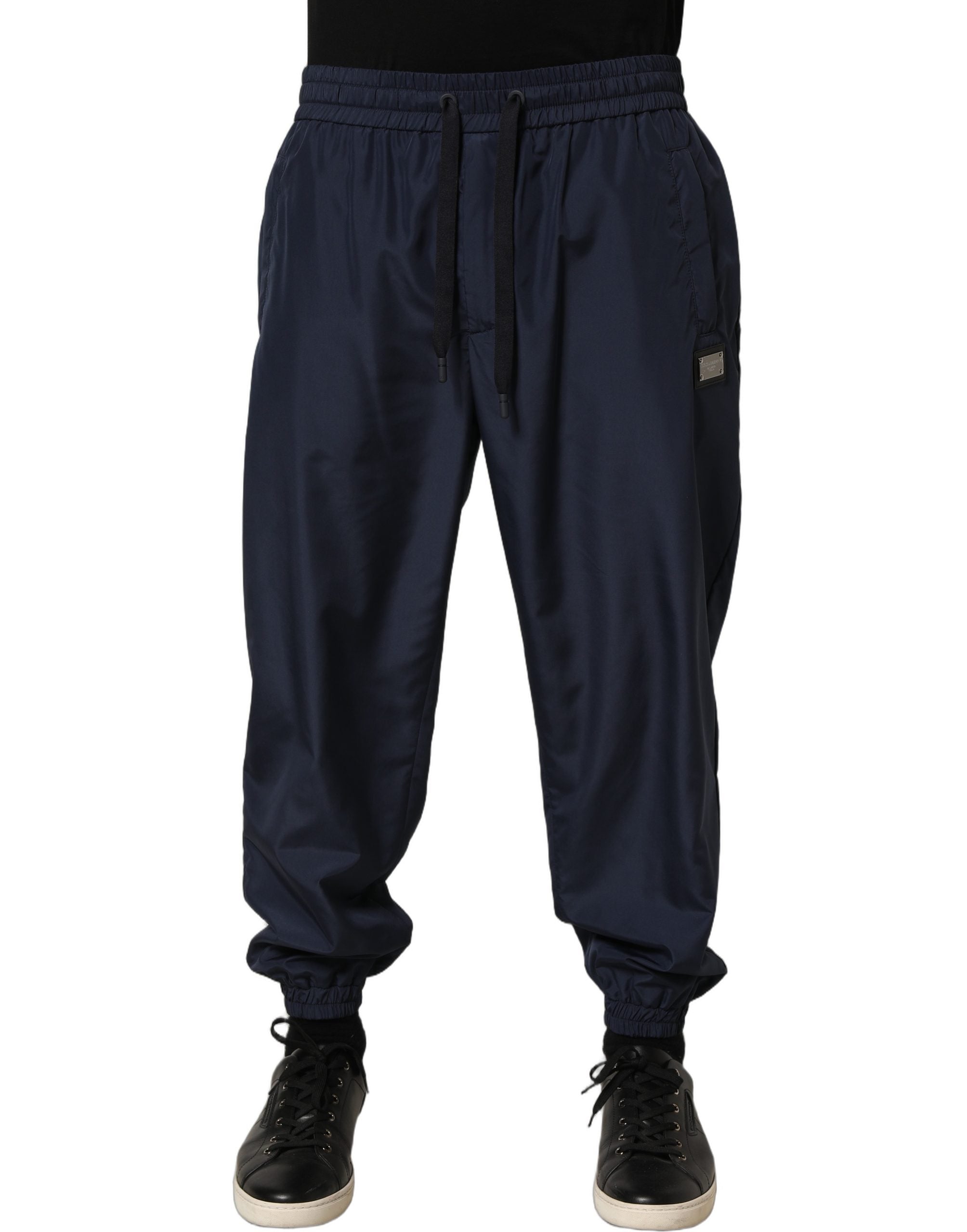 Elevate your style with Dolce & Gabbana's Dark Blue Jogger Sweatpants, where exquisite Italian craftsmanship meets modern luxury for the discerning individual.