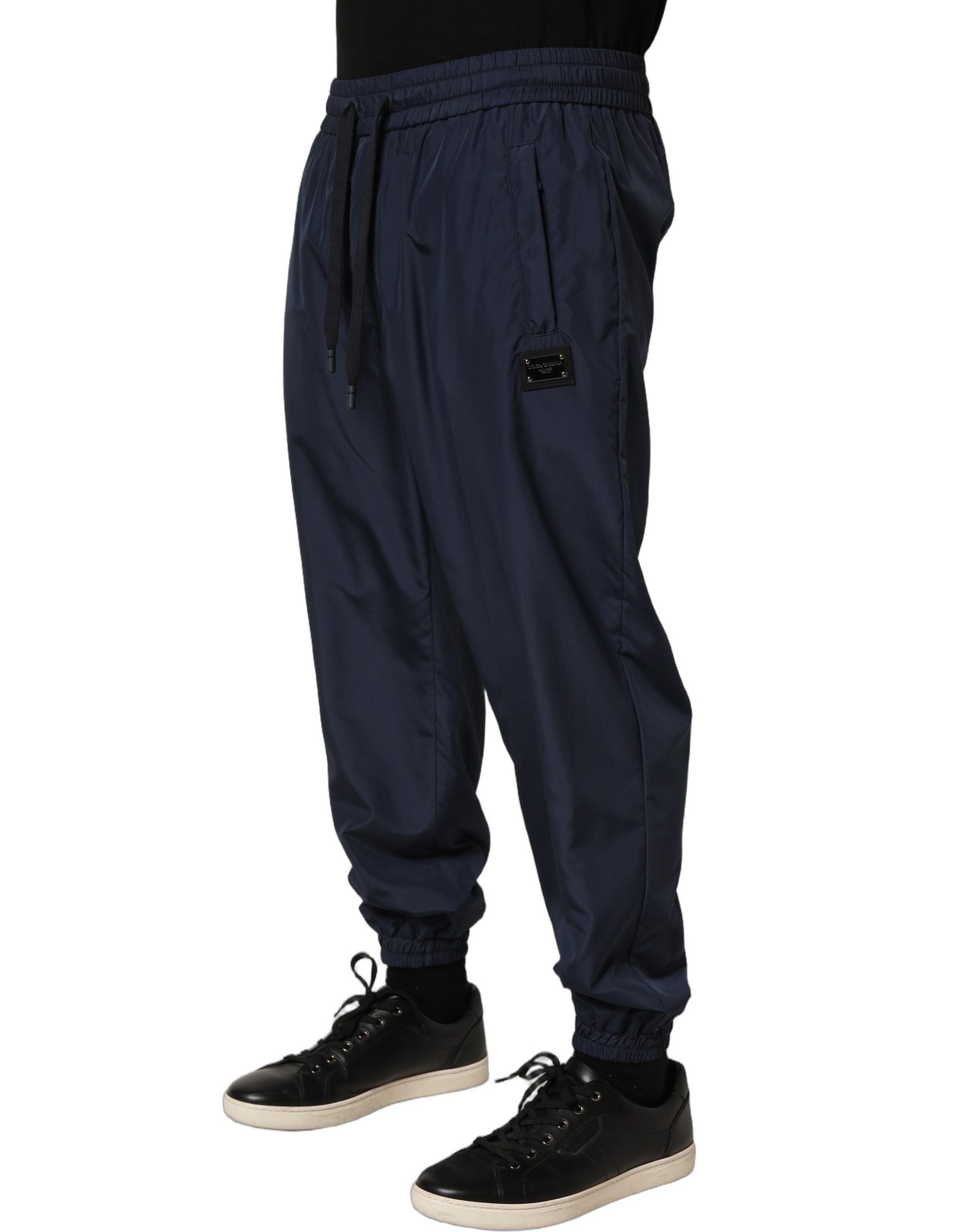 Indulge in the exquisite Dolce & Gabbana Dark Blue Jogger Sweatpants, where luxurious craftsmanship meets modern elegance, perfect for the discerning individual.