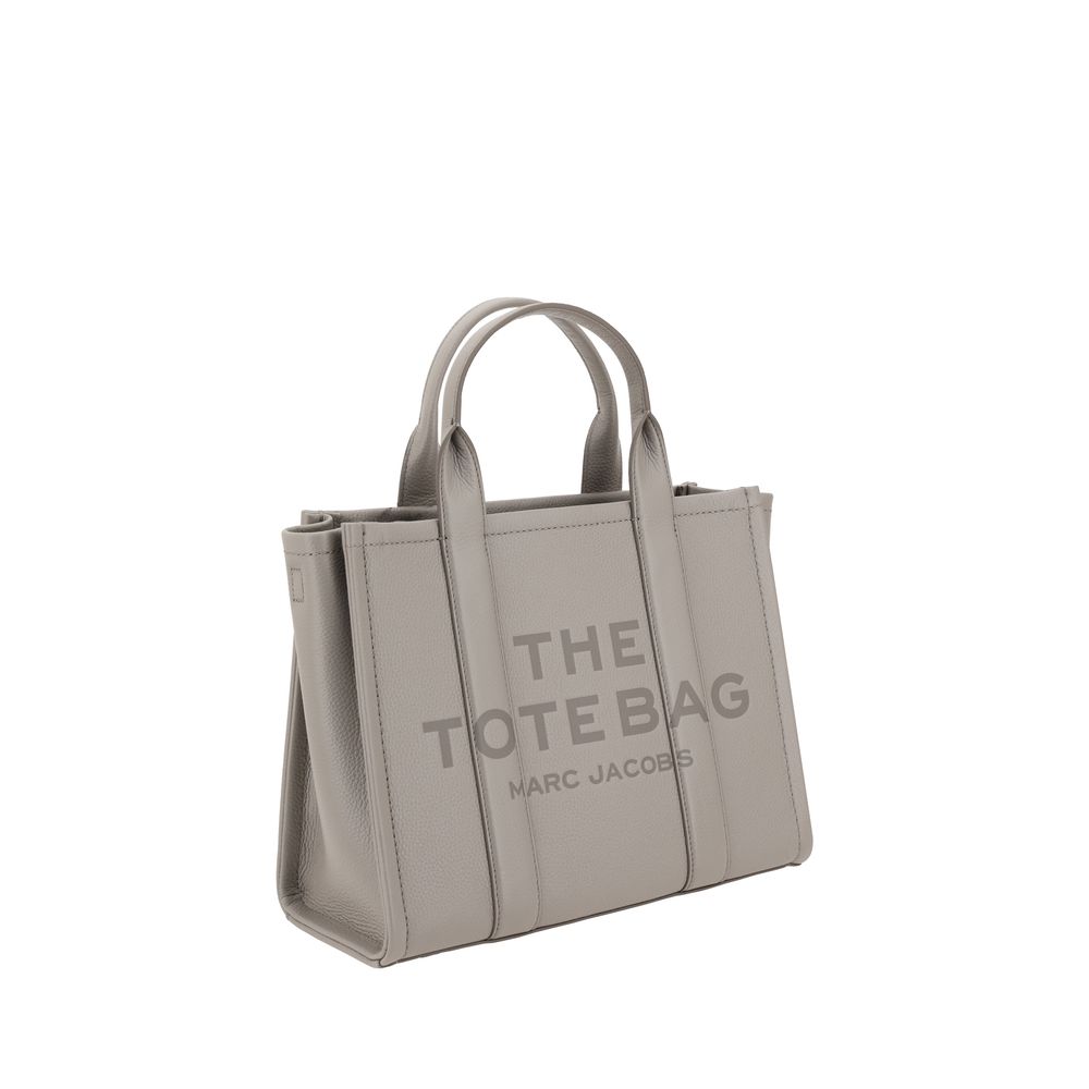 Indulge in the elegance of the Marc Jacobs Gray Calf Leather Bos Taurus Handbag, a luxurious statement piece crafted from exquisite grained leather for the discerning individual.