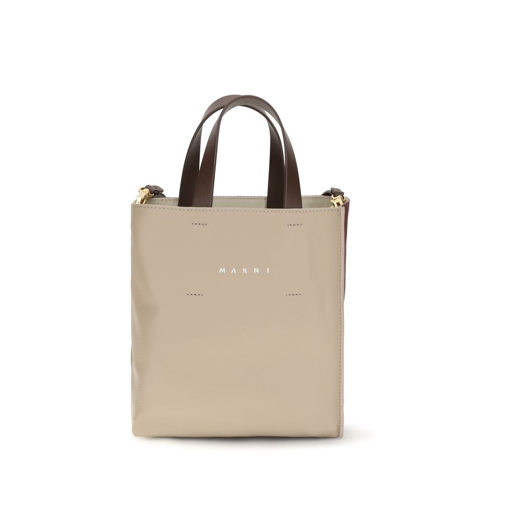 Discover the Marni Beige Calf Leather Bos Taurus Shoulder Bag, a luxurious blend of exquisite craftsmanship and timeless elegance, perfect for the discerning connoisseur.