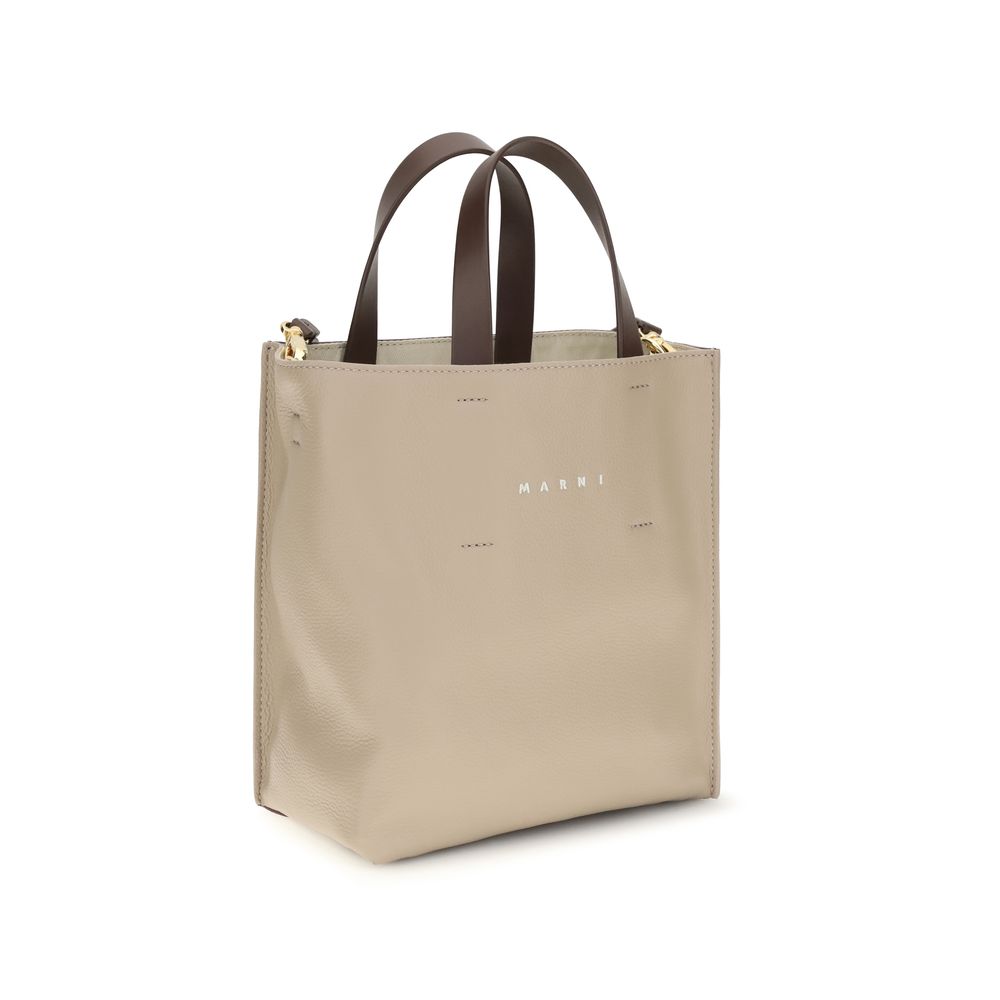 Elevate your style with the Marni Beige Calf Leather Bos Taurus Shoulder Bag, a masterpiece of artisanal craftsmanship that embodies refined elegance and timeless sophistication.