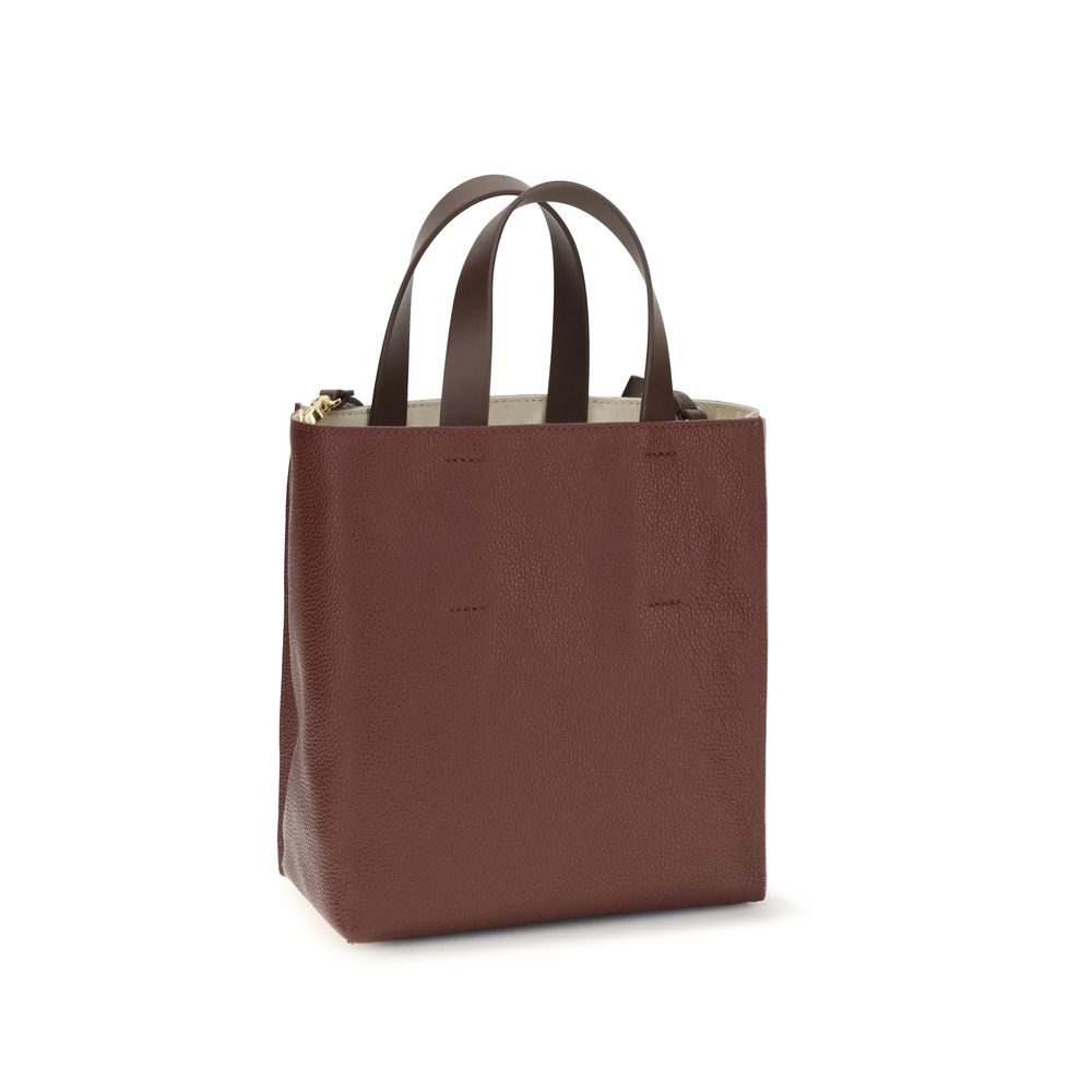 Discover the Marni Beige Calf Leather Bos Taurus Shoulder Bag, a masterpiece of hammered leather that embodies luxury and sophistication for the discerning connoisseur.