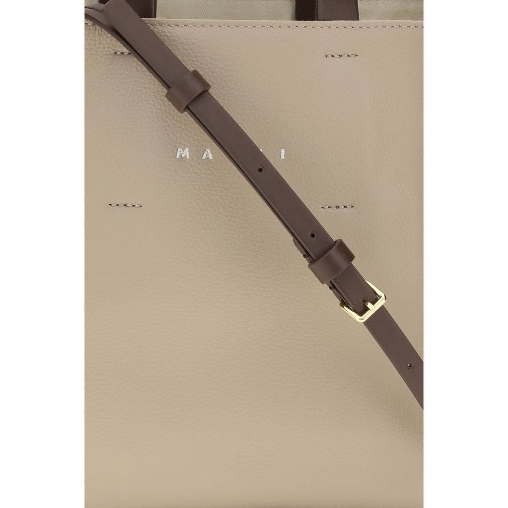 Elevate your style with the Marni Beige Calf Leather Bos Taurus Shoulder Bag, a masterpiece of craftsmanship that embodies luxury and sophistication for every occasion.