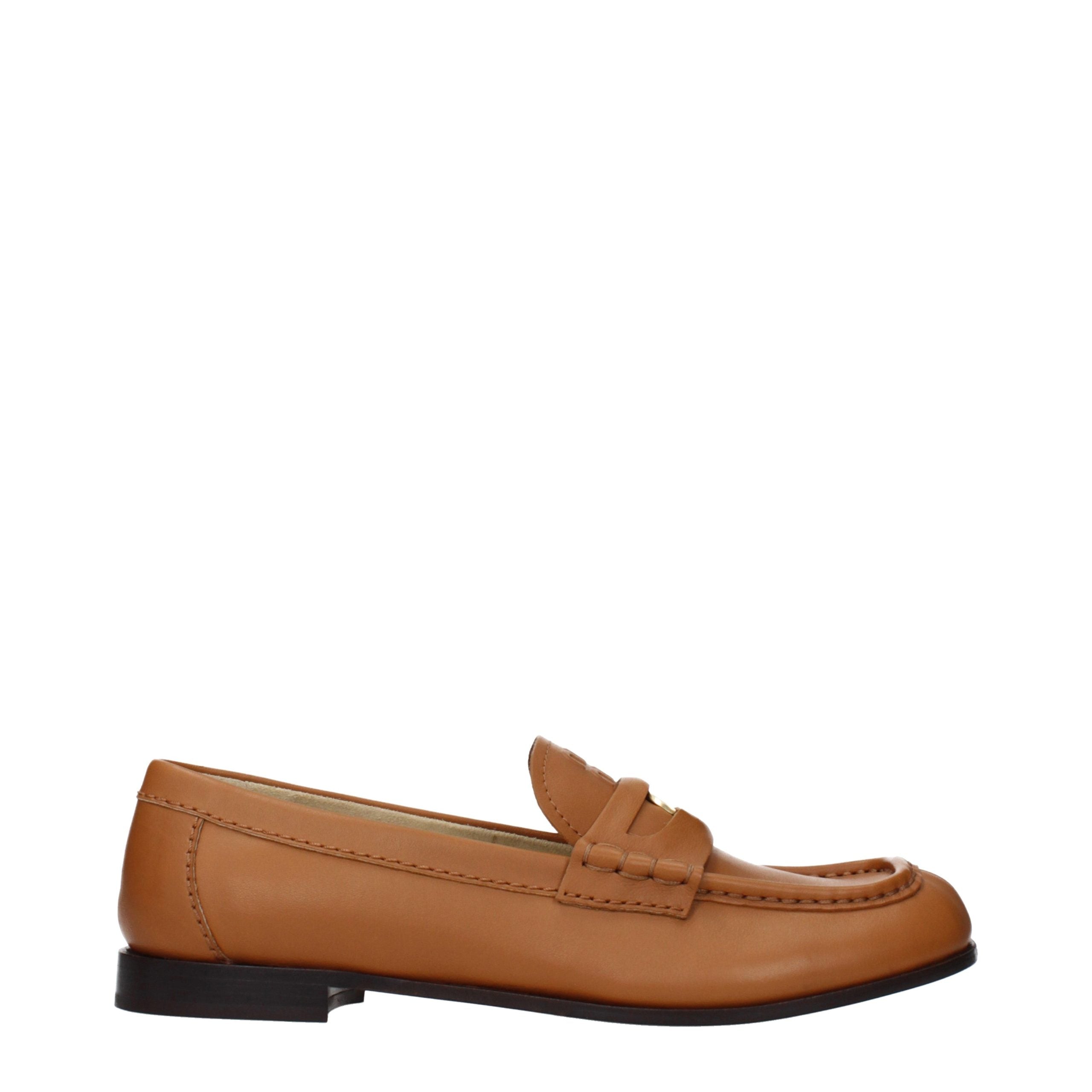 Discover Miu Miu's Brown Leather Slip-On Loafers, where exquisite craftsmanship meets timeless elegance, perfect for the discerning individual who embraces luxury.