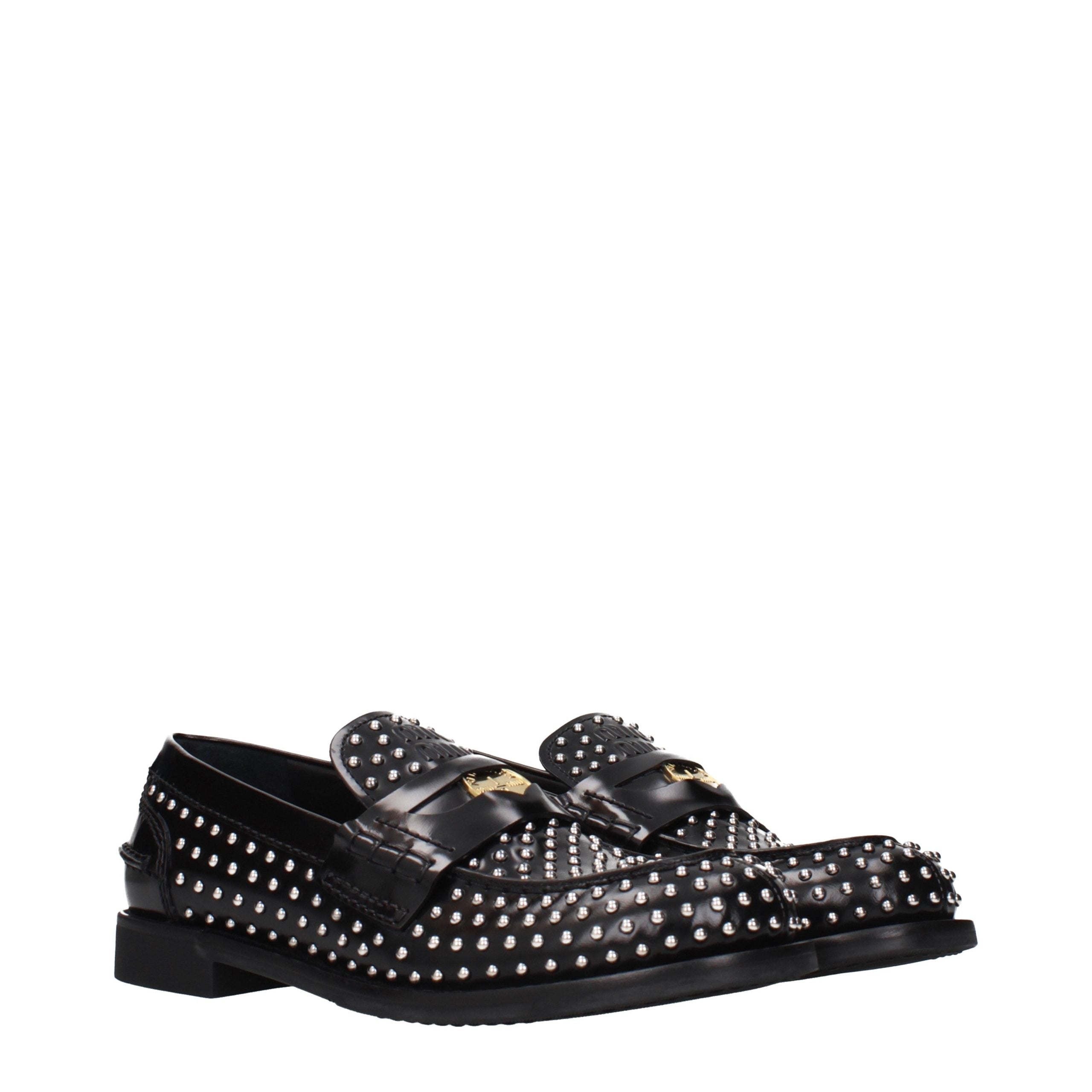Elevate your style with Miu Miu's Black Leather Slip-On Loafers, where exquisite craftsmanship meets timeless elegance, perfect for the discerning individual.