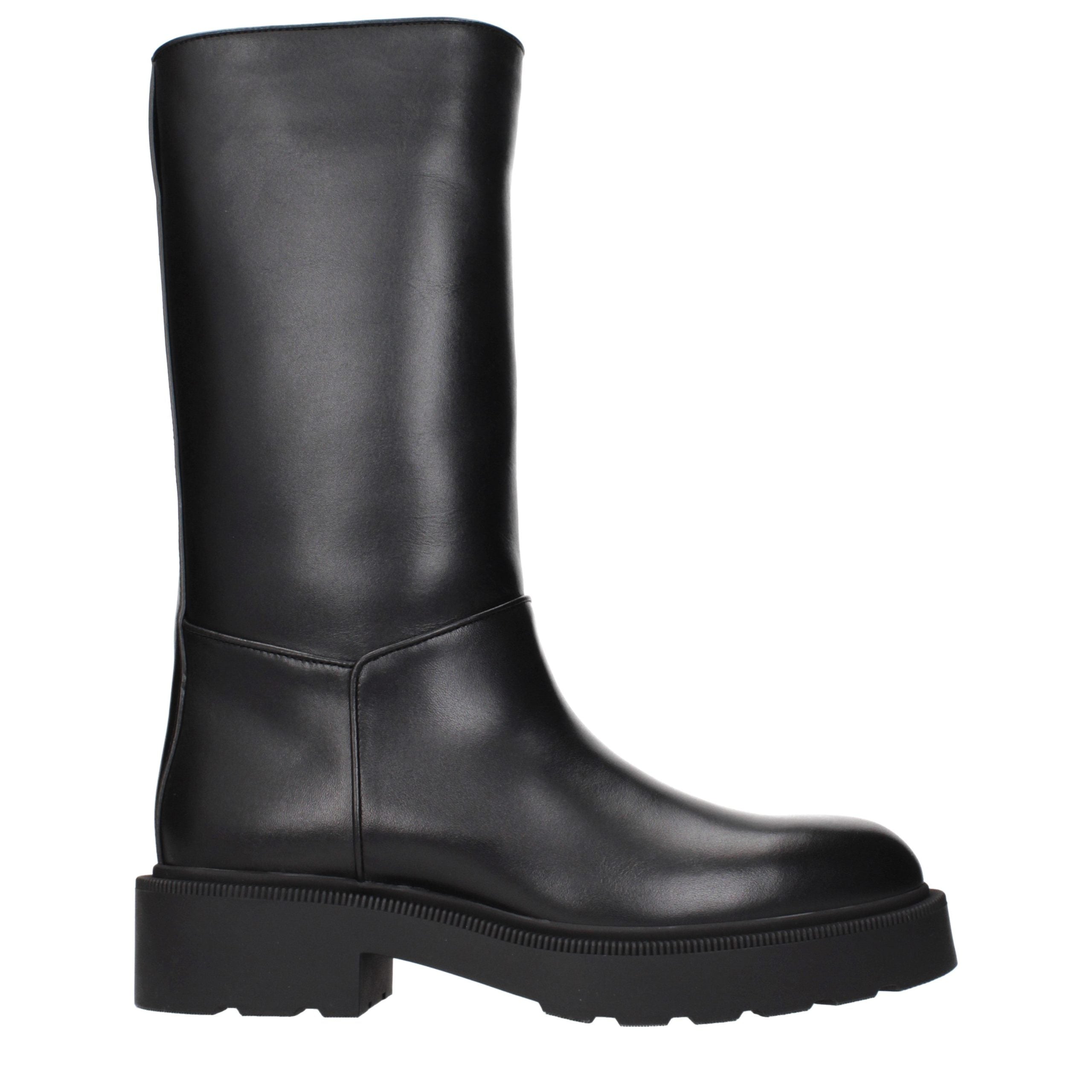 Step into unparalleled elegance with The Row Black Leather Boots, where artisanal craftsmanship meets luxurious design, perfect for the discerning individual.