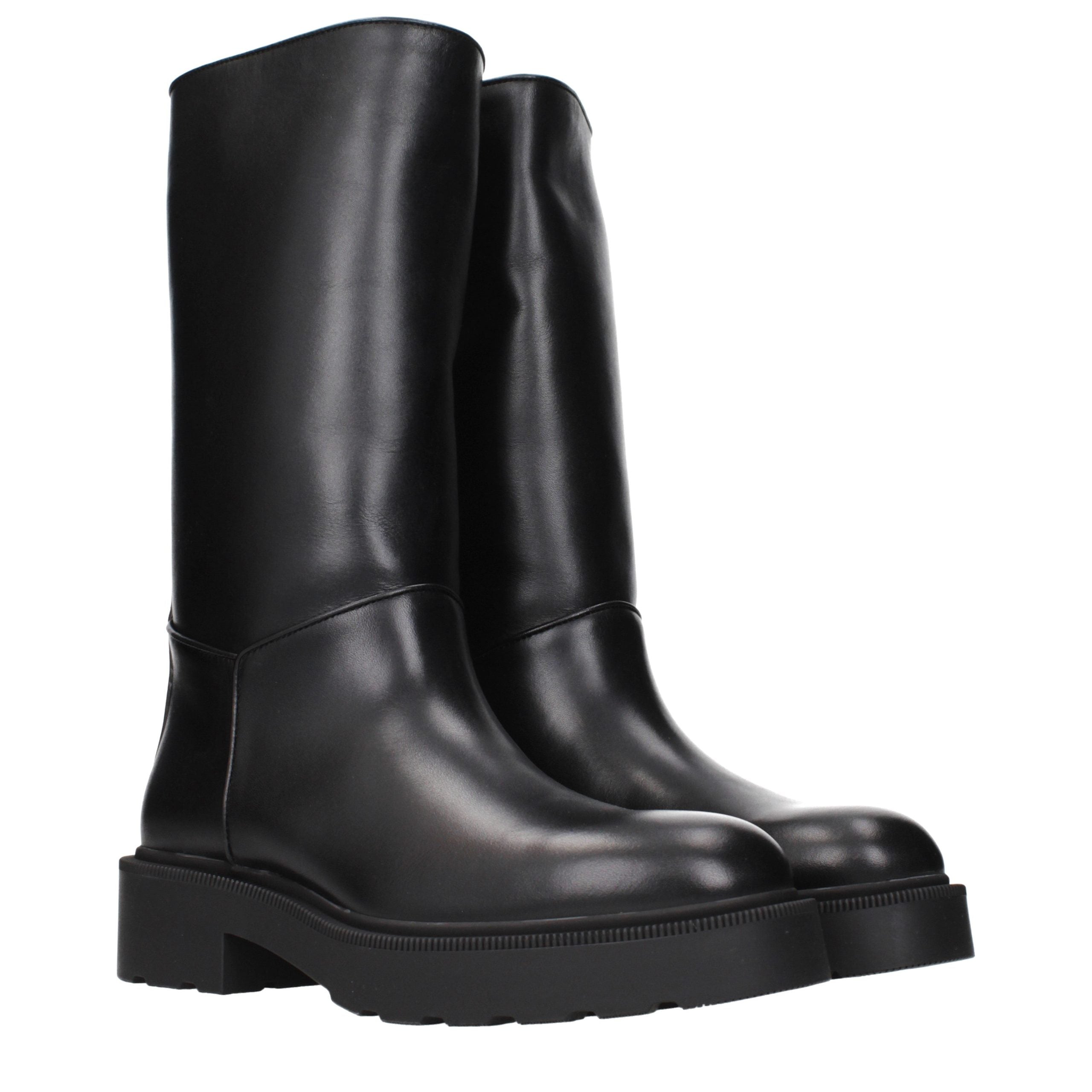 Step into the realm of elegance with The Row Black Leather Boots, where artisanal craftsmanship meets luxurious design, perfect for the discerning individual.