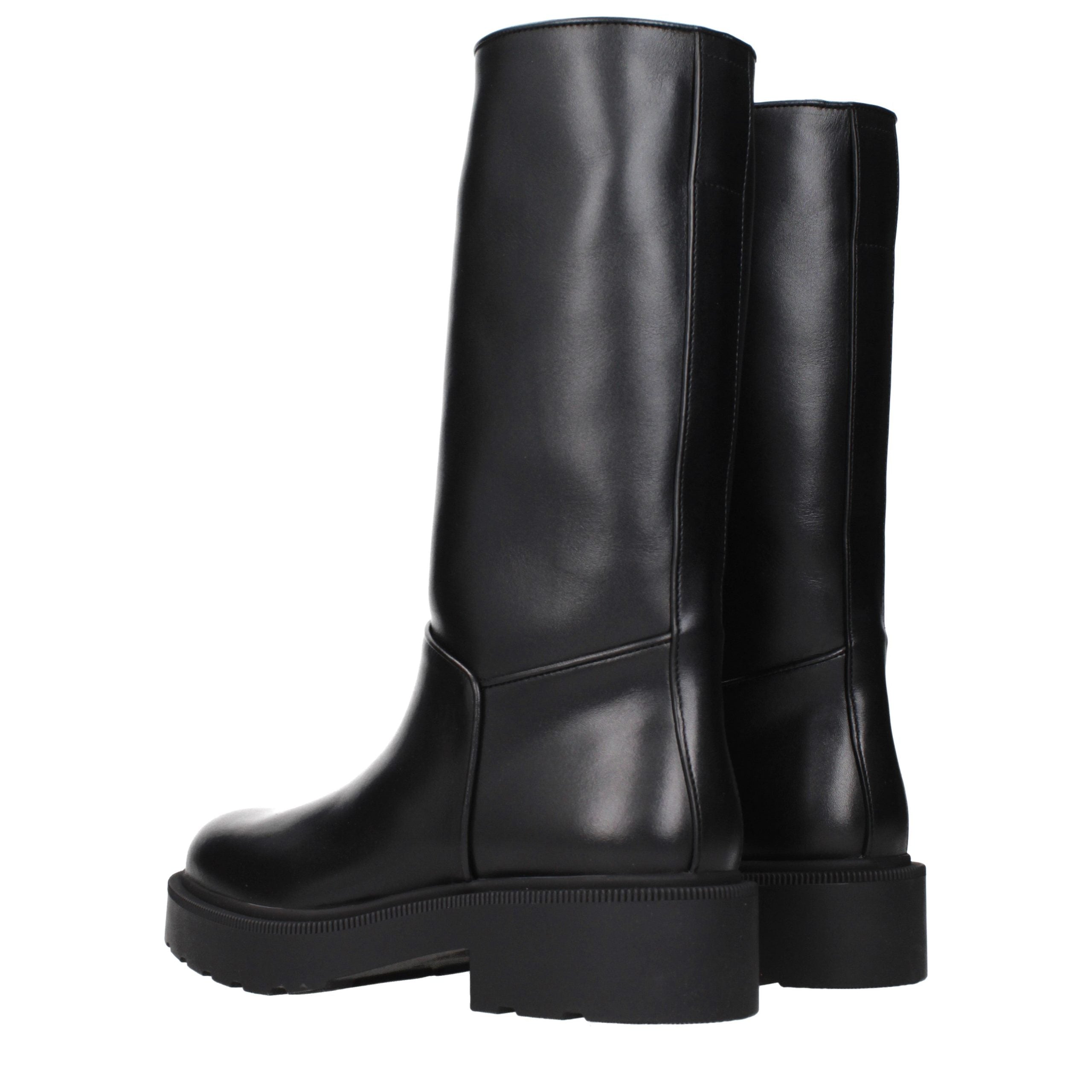 Step into a realm of elegance with The Row Black Leather Boots, where artisanal craftsmanship meets luxurious design, perfect for the discerning individual.