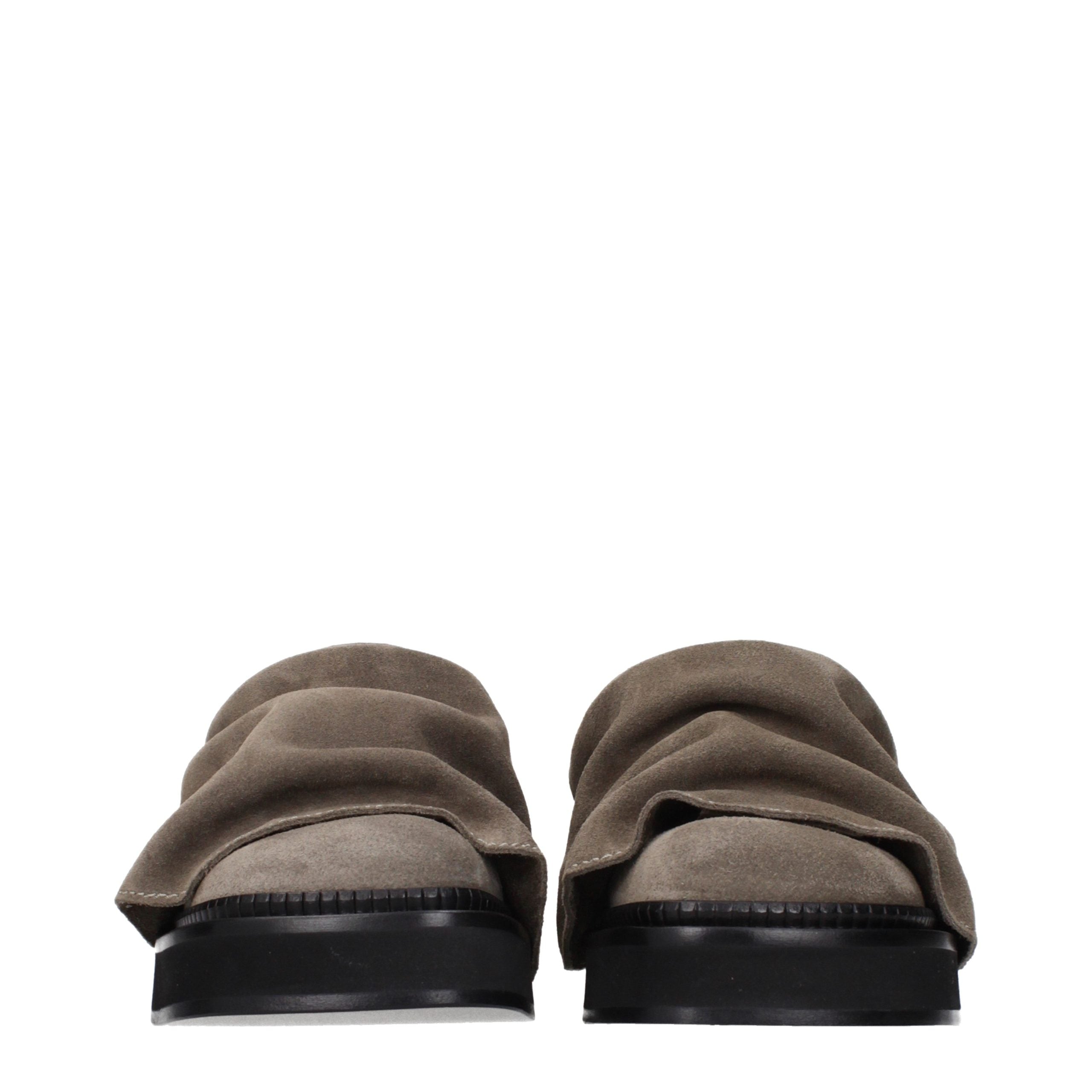Step into a world of opulence with The Attico Gray Leather Slippers, where exquisite craftsmanship meets vintage elegance, perfect for the discerning individual.