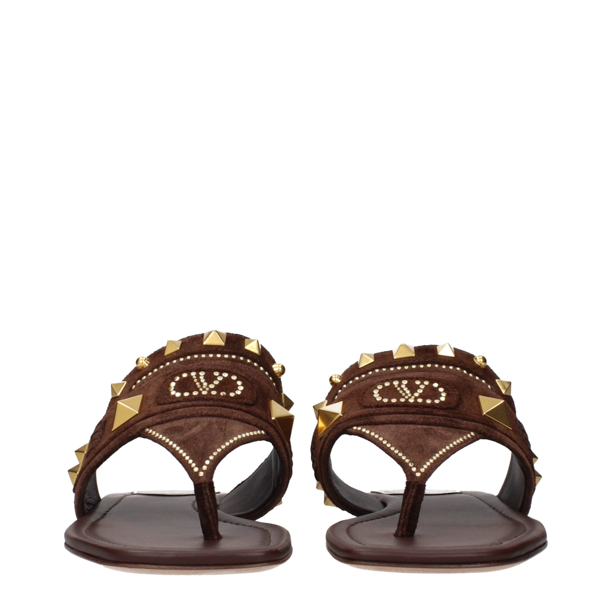 Experience the allure of Valentino Garavani Brown Leather Flip-Flop Sandals, where exquisite craftsmanship meets timeless elegance for the discerning individual.