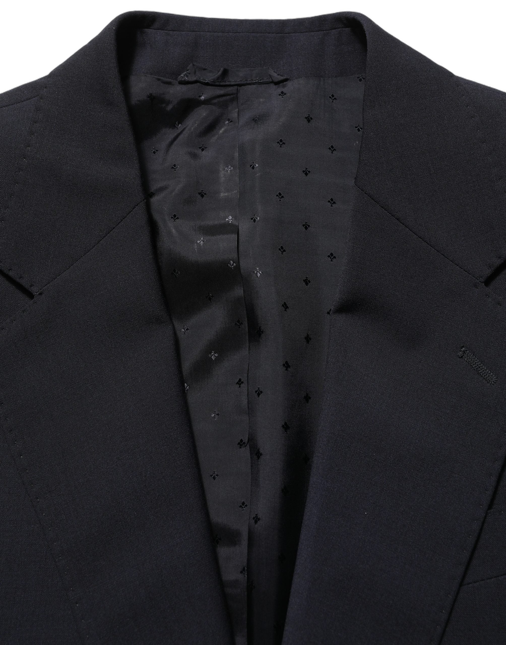 Discover the Dolce & Gabbana Black Wool Slim Fit Formal 3 Piece Suit, a testament to Italian craftsmanship that embodies sophistication and timeless elegance.