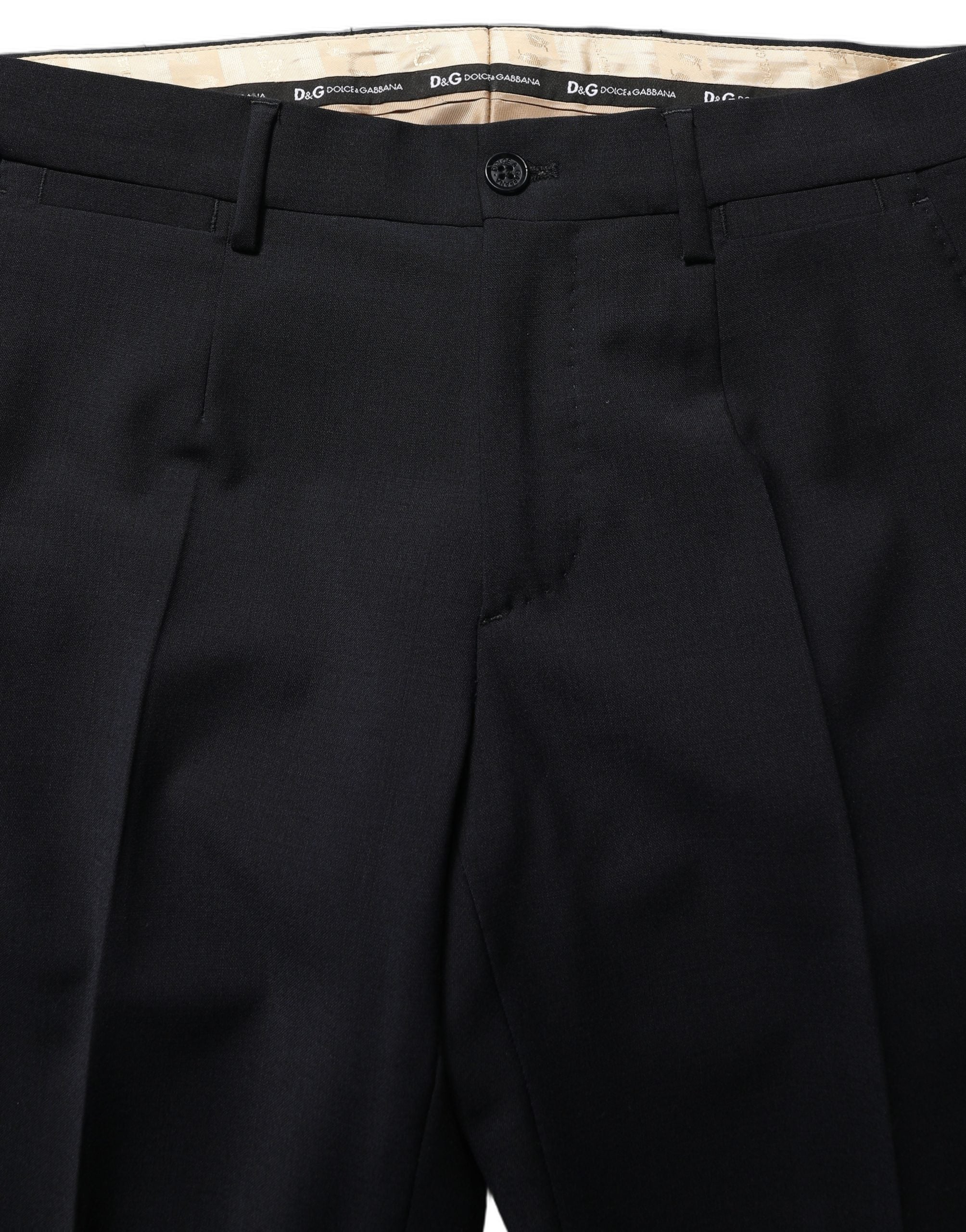 Discover the Dolce & Gabbana Black Wool Slim Fit Formal 3 Piece Suit, a testament to Italian craftsmanship that redefines elegance and sophistication for discerning tastes.