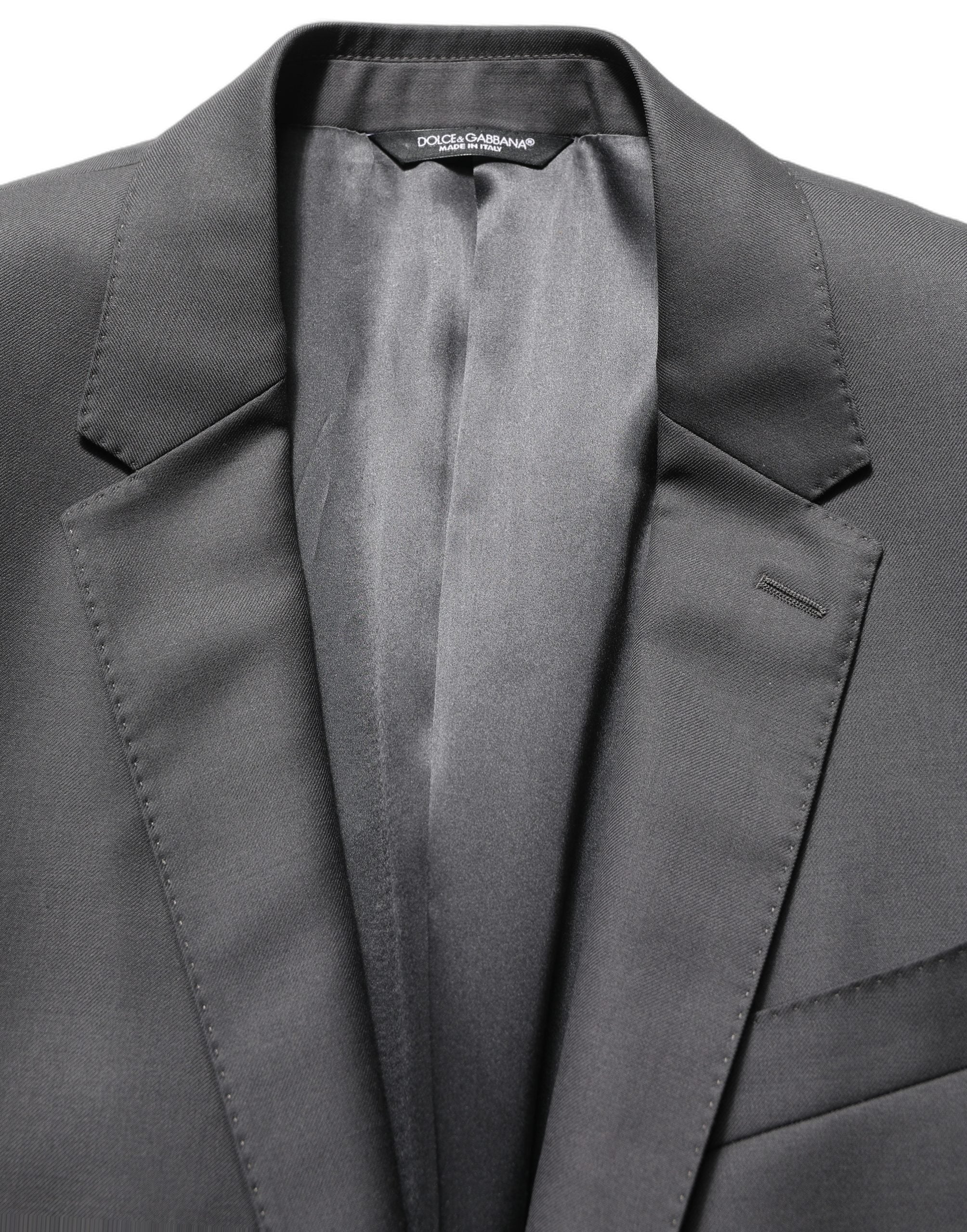 Elevate your style with the Dolce & Gabbana Gray MARTINI Slim Fit Suit, a masterpiece in virgin wool that embodies sophistication and timeless luxury.