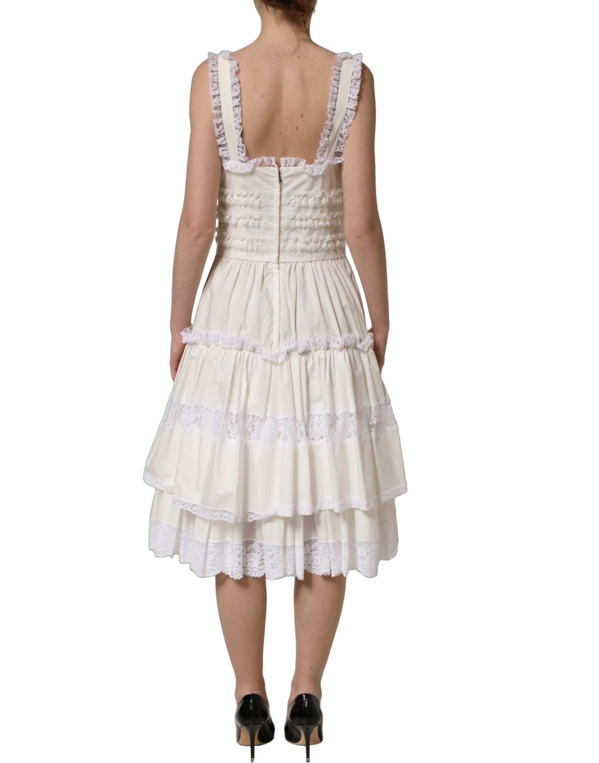 Experience the allure of the Dolce & Gabbana White Cotton Poplin Ruffled Midi Dress, where exquisite craftsmanship meets timeless elegance for the discerning individual.