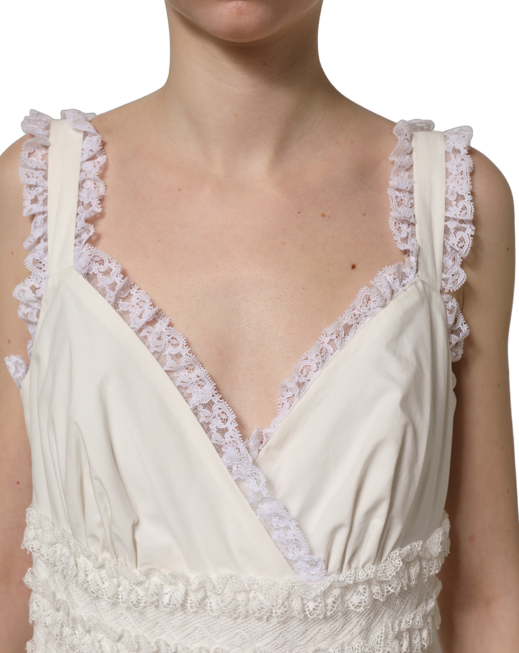 Experience the allure of the Dolce & Gabbana White Cotton Poplin Ruffled Midi Dress, a masterpiece of Italian craftsmanship that redefines luxury and elegance.
