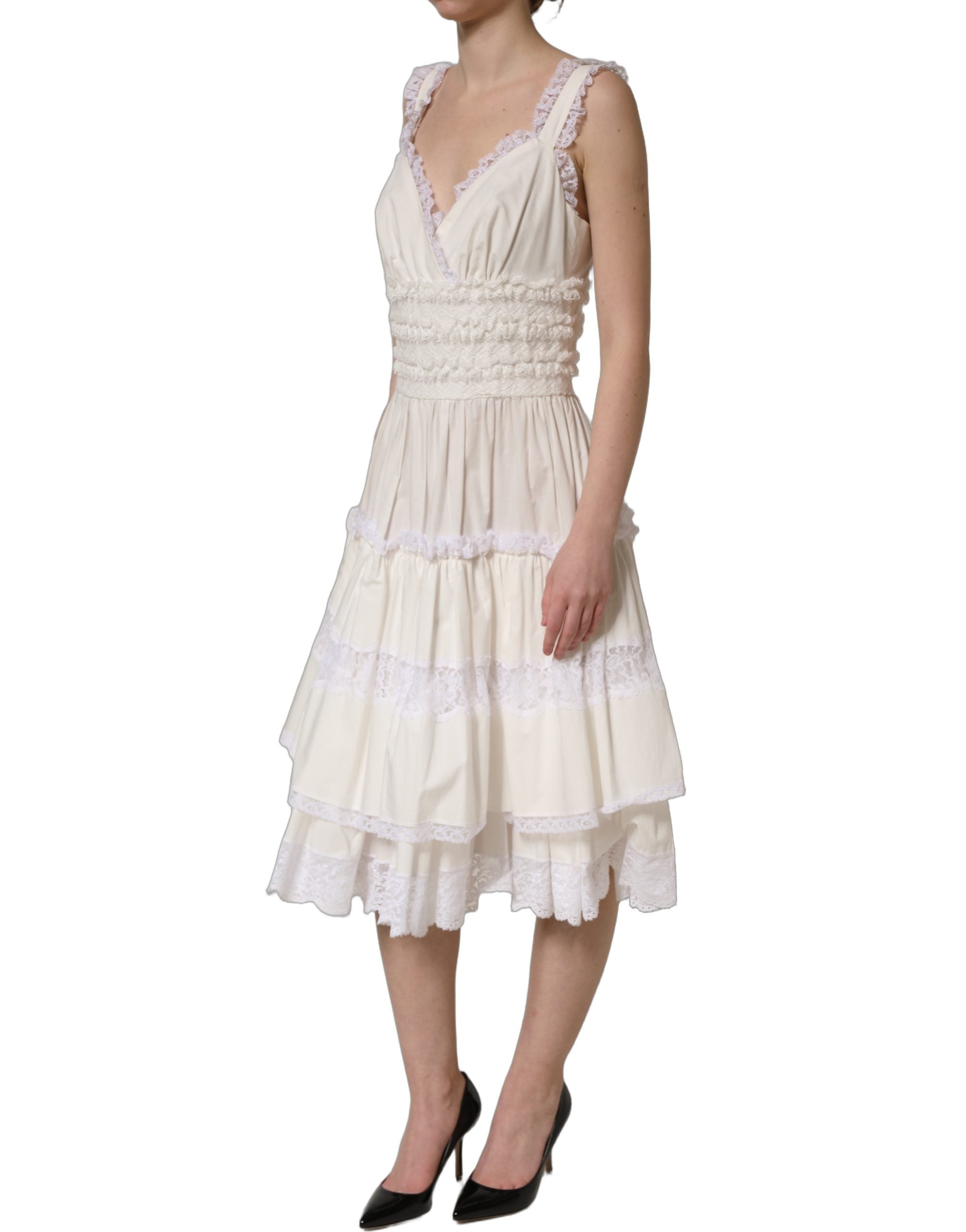 Experience the allure of the Dolce & Gabbana White Cotton Poplin Ruffled Midi Dress, a testament to Italian craftsmanship that redefines luxury and sophistication.