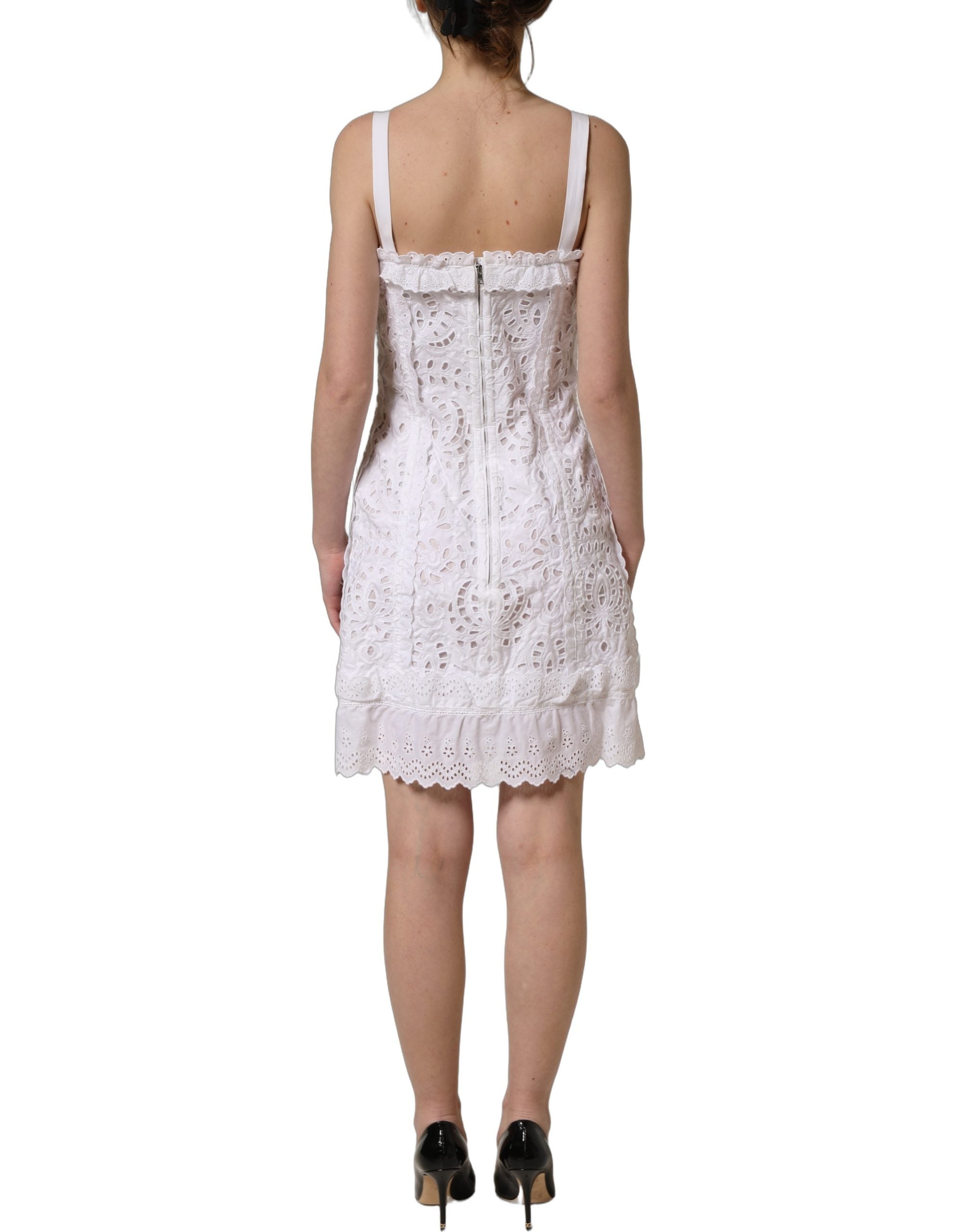 Discover the exquisite Dolce & Gabbana White Broderie Anglaise Mini Dress, a timeless blend of luxury craftsmanship and ethereal elegance, perfect for any sophisticated occasion.