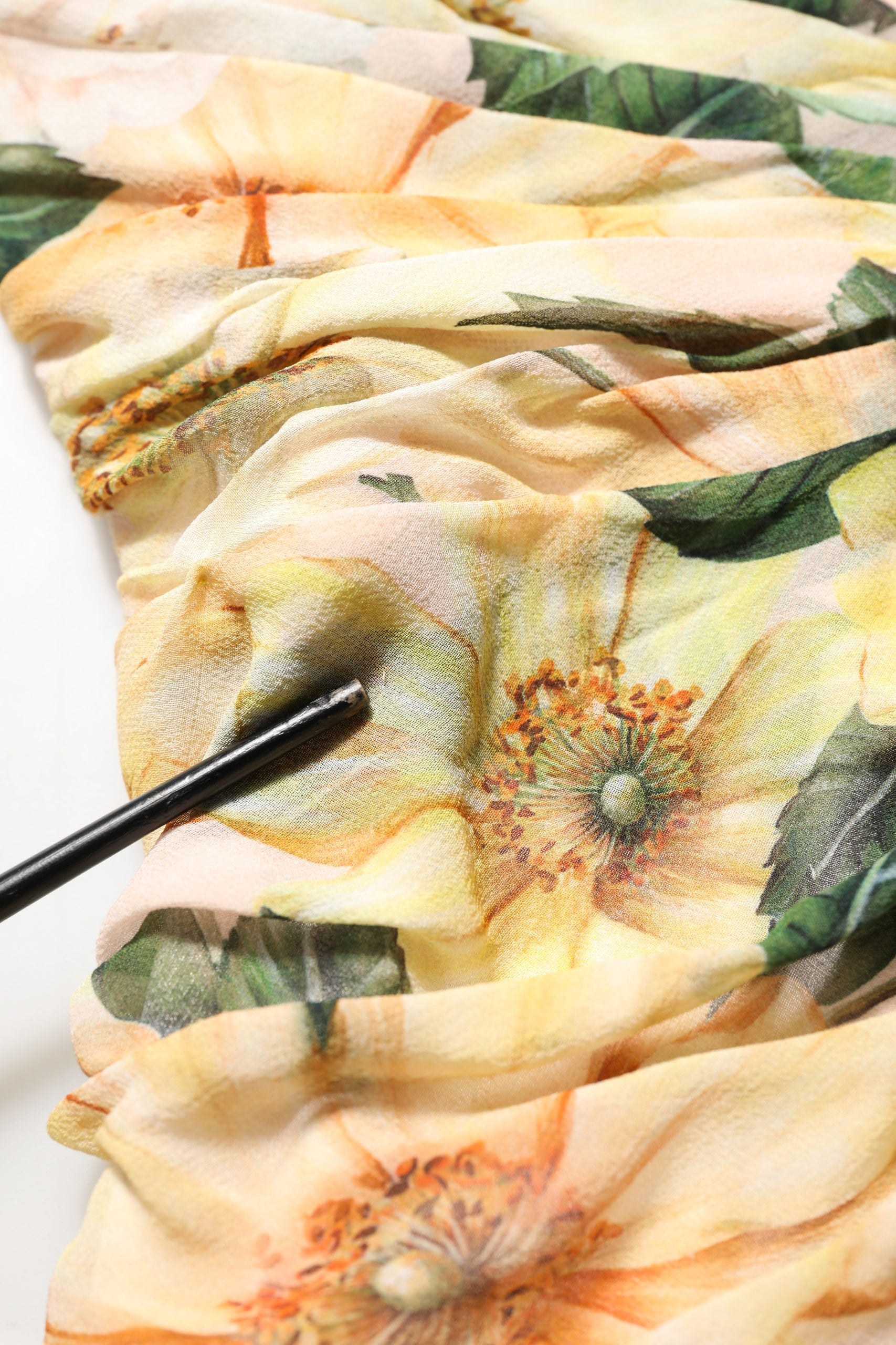 Indulge in the exquisite Dolce & Gabbana Yellow Floral Print Silk Pleated Maxi Dress, a masterpiece of Italian craftsmanship that embodies timeless elegance and sophistication.