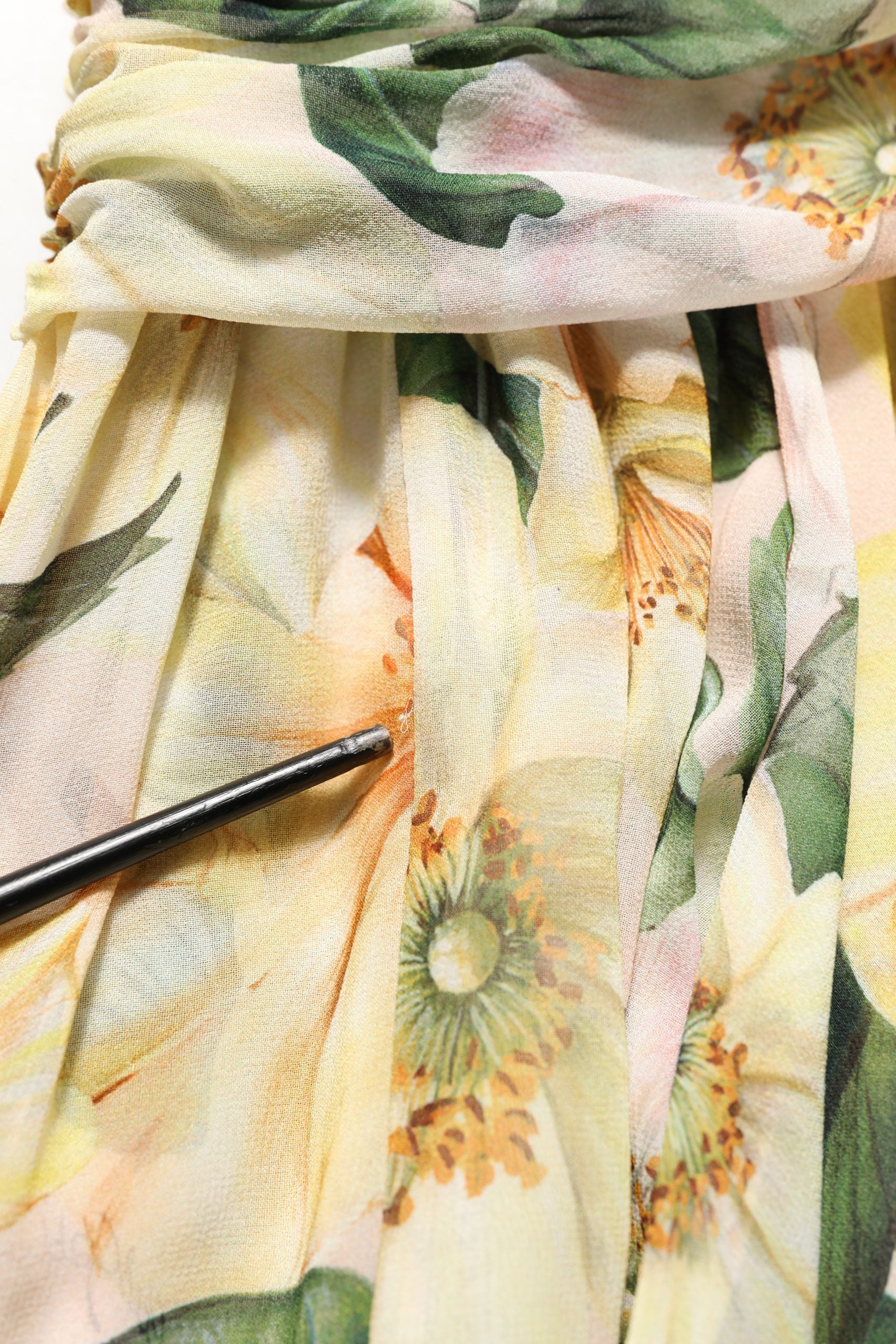 Indulge in the exquisite Dolce & Gabbana Yellow Floral Print Silk Pleated Maxi Dress, where Italian craftsmanship meets timeless elegance, perfect for sophisticated occasions.