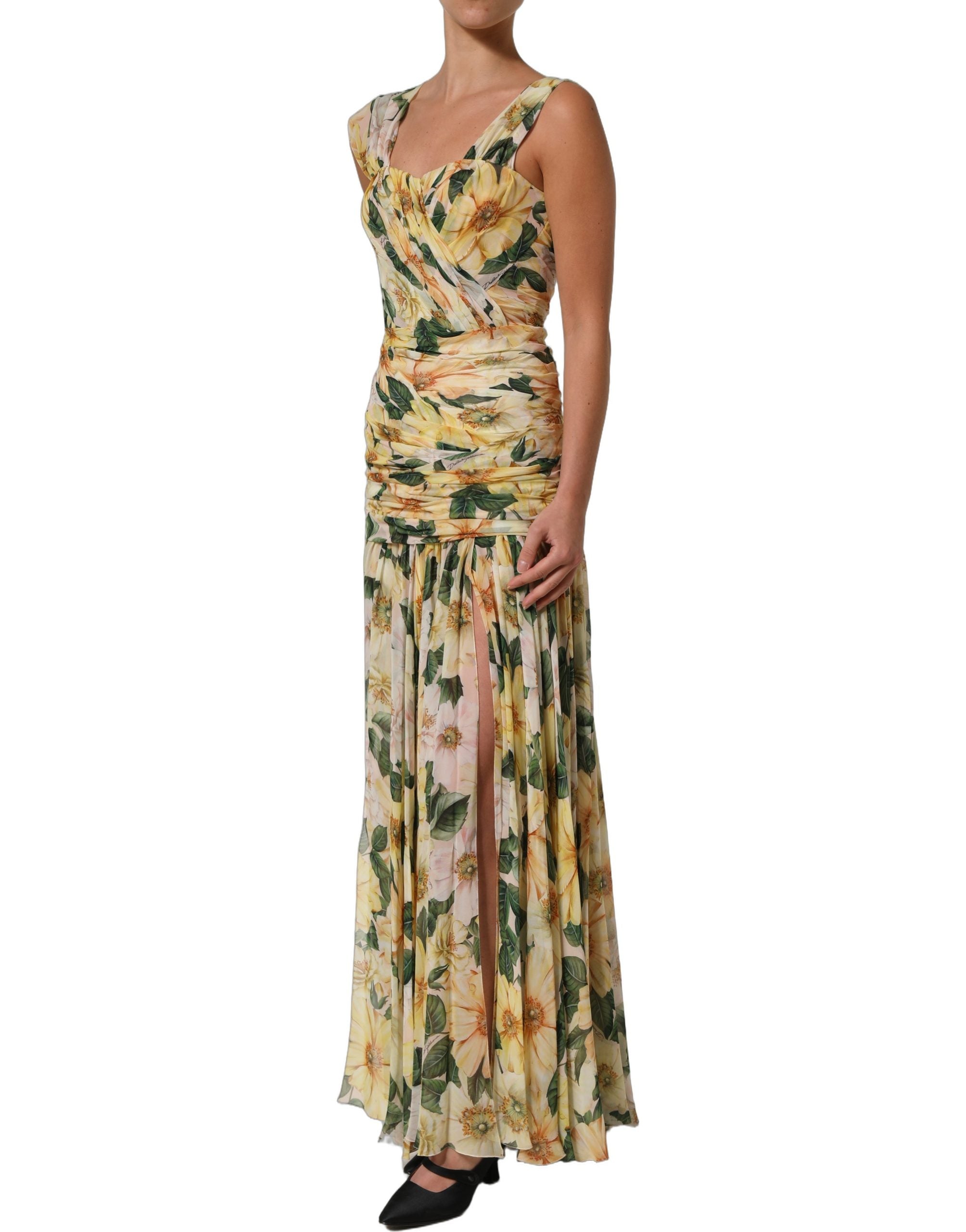 Indulge in the exquisite Dolce & Gabbana Yellow Floral Print Silk Pleated Maxi Dress, a masterpiece of Italian craftsmanship that embodies timeless elegance and sophistication.