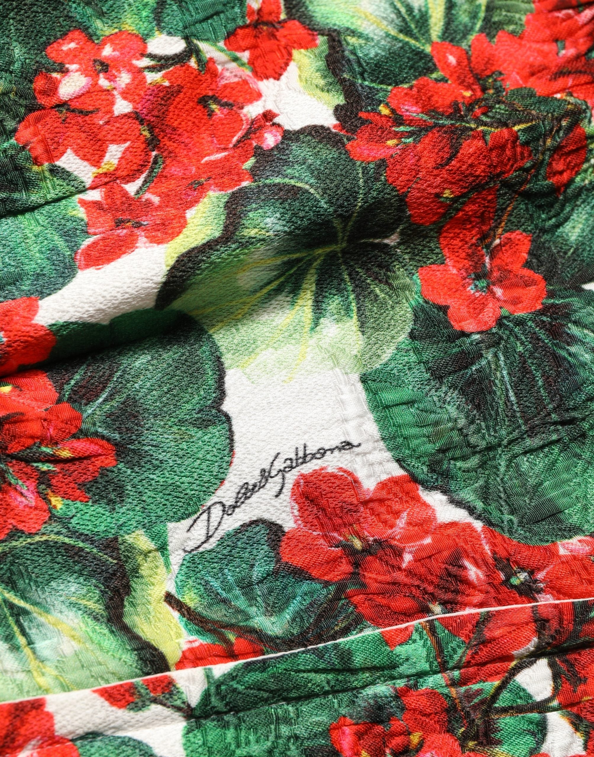Elevate your wardrobe with the Dolce & Gabbana Multicolor Geranium Print A-line Mini Dress, a masterpiece of luxury craftsmanship and vibrant elegance, perfect for any sophisticated occasion.
