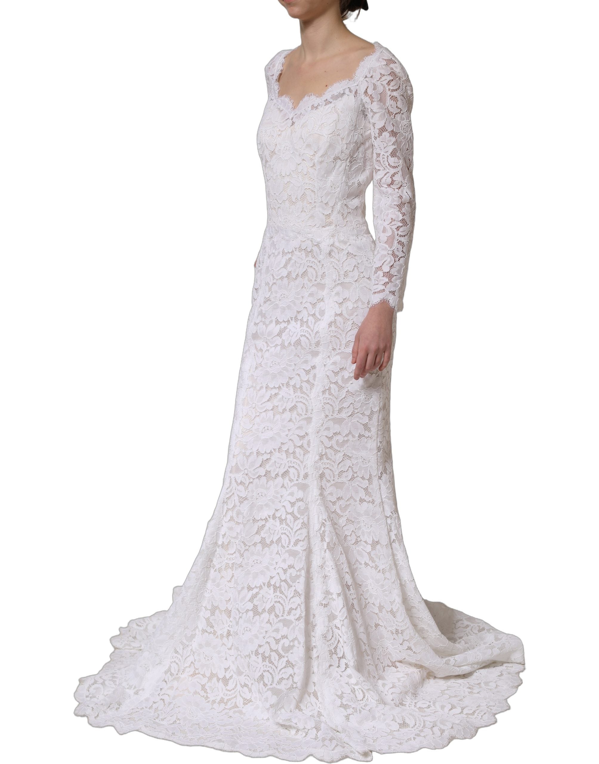 Experience the allure of the Dolce & Gabbana White Floral Lace Mermaid Long Gown, a testament to exquisite craftsmanship and timeless elegance, perfect for unforgettable moments.