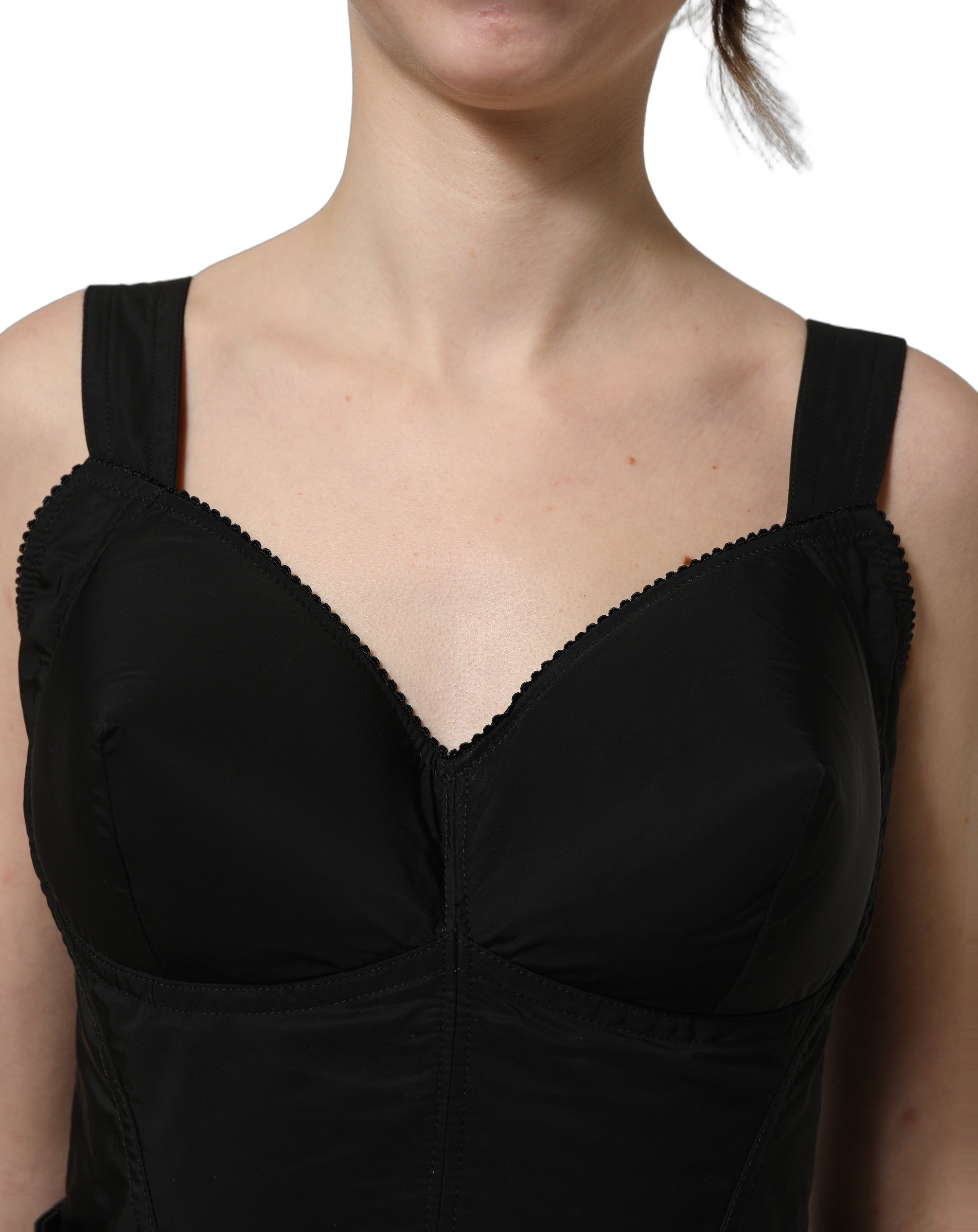 Indulge in the exquisite allure of the Dolce & Gabbana Black Nylon A-Line Mini Dress, a masterpiece of Italian craftsmanship designed for unforgettable evenings.