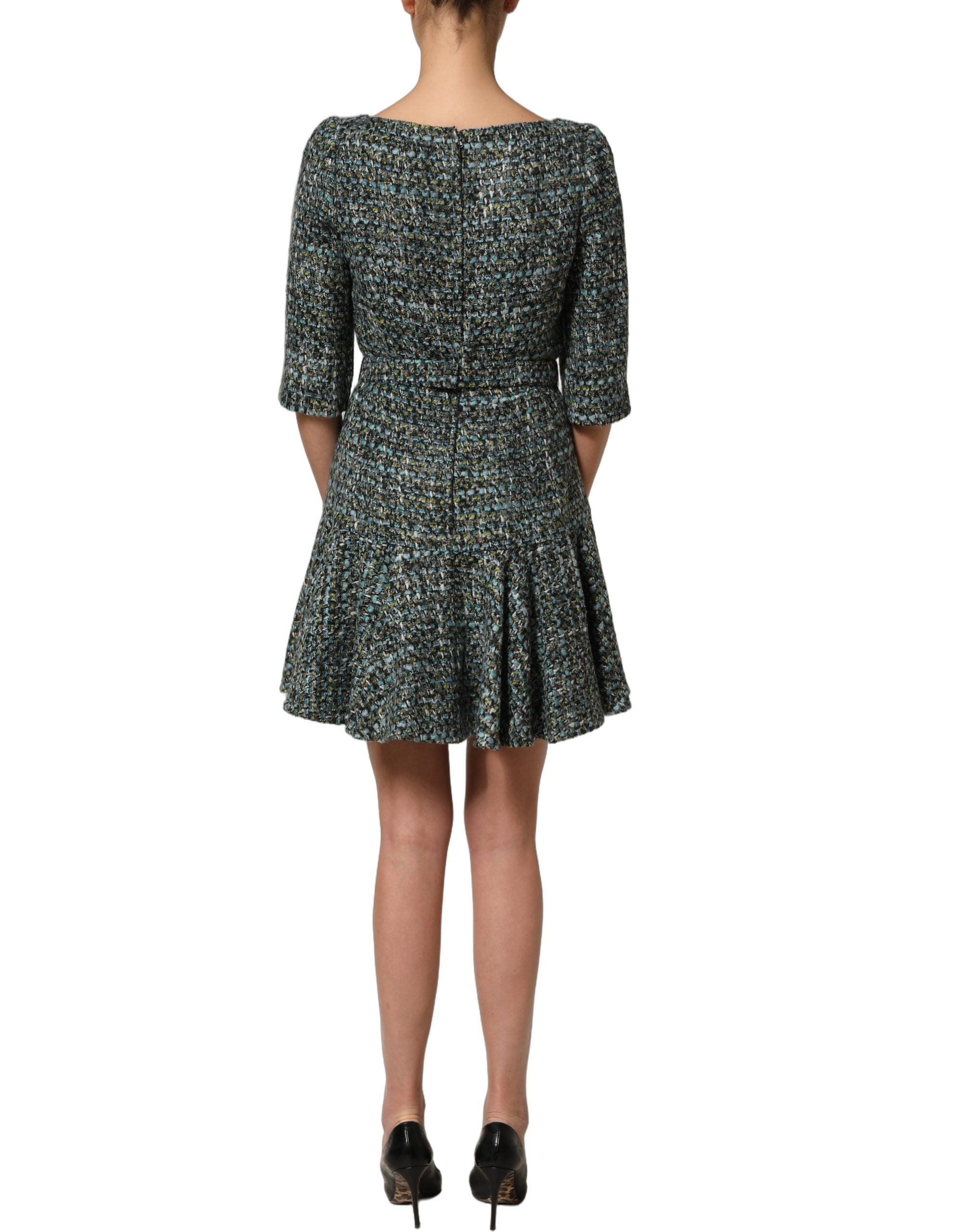 Elevate your elegance with the Dolce & Gabbana Multicolor Tweed Belted Babydoll Mini Dress, a masterpiece of Italian craftsmanship that embodies timeless allure and sophistication.