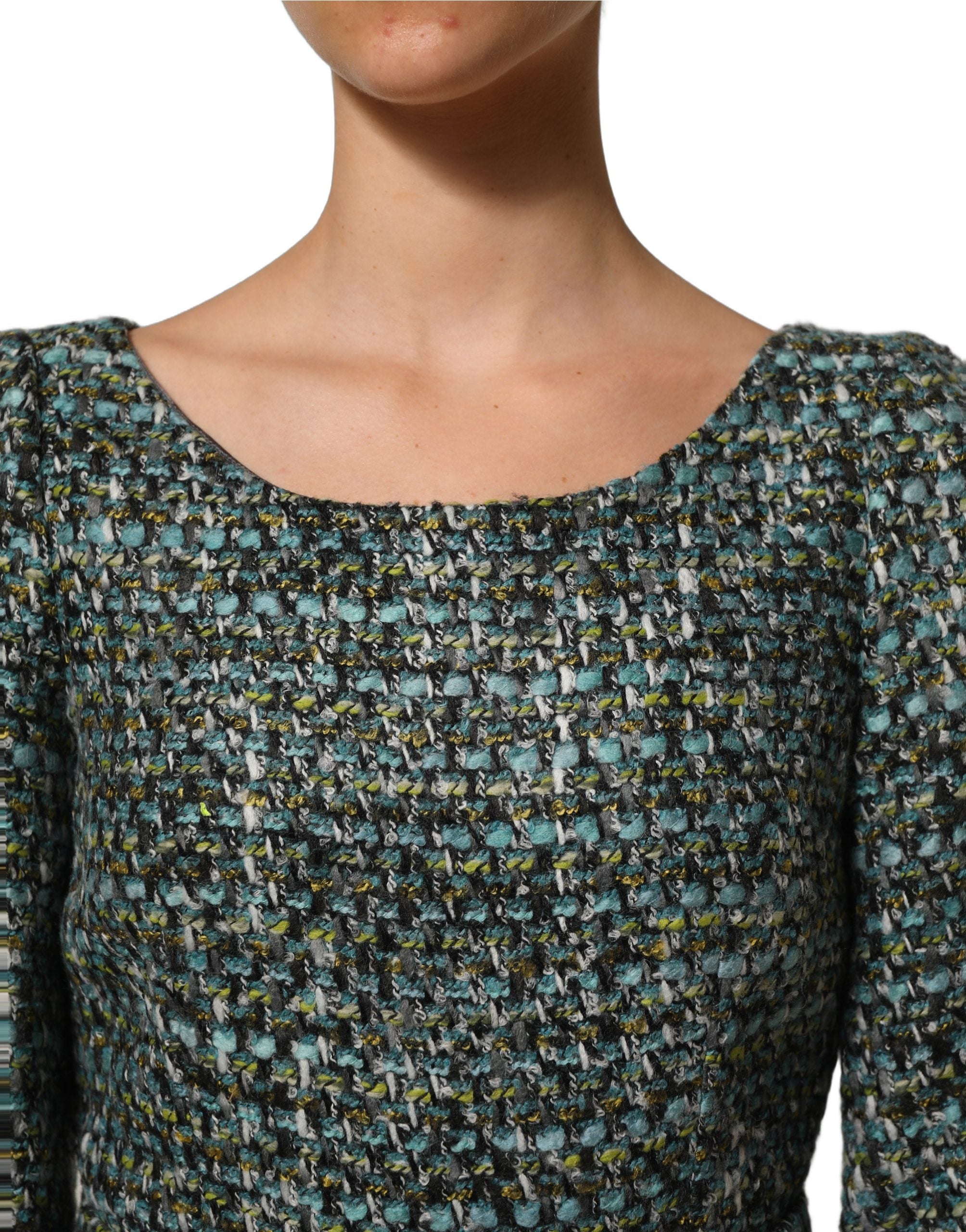 Experience the allure of the Dolce & Gabbana Multicolor Tweed Belted Babydoll Mini Dress, a masterpiece of Italian craftsmanship that embodies elegance and sophistication.