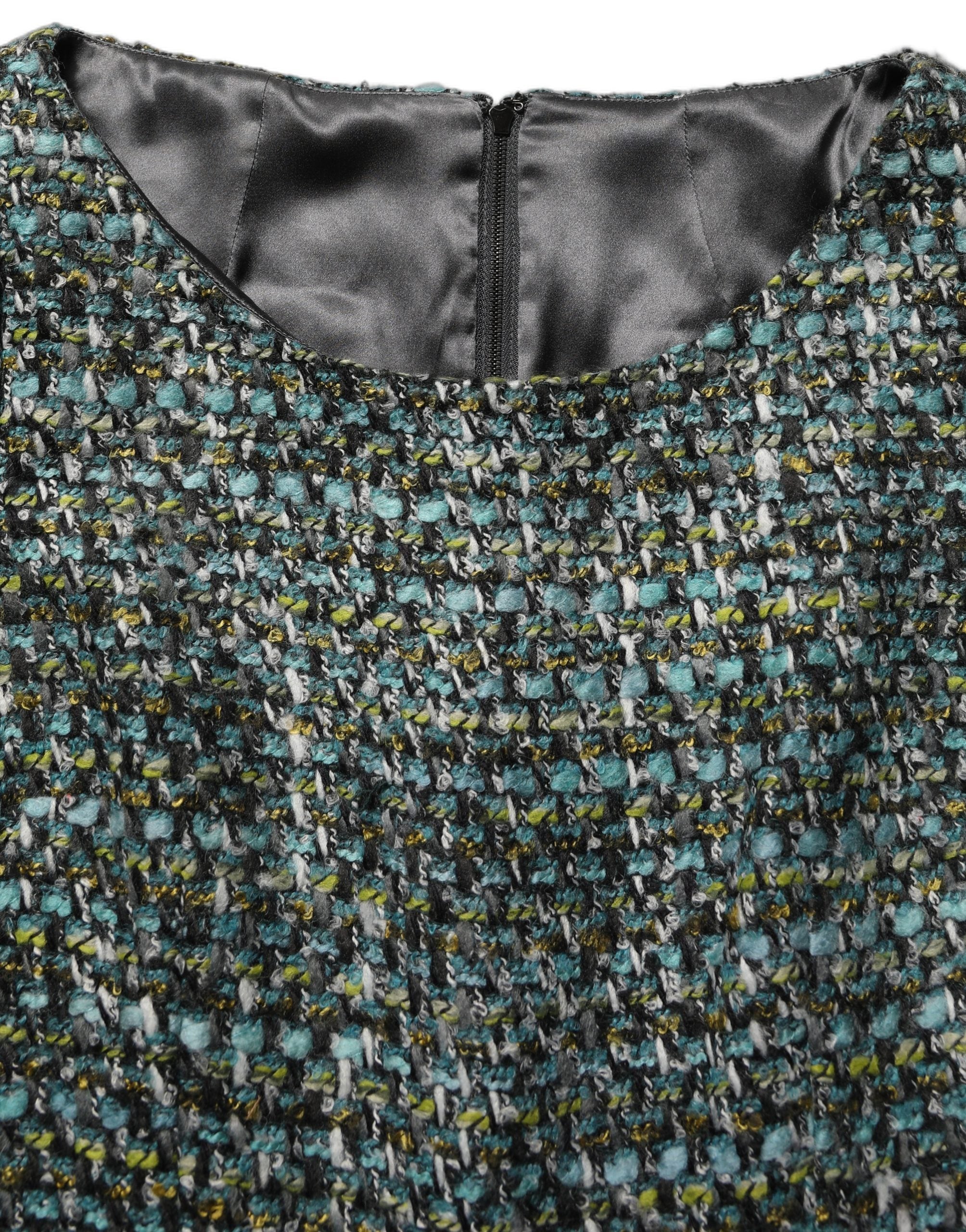 Experience the allure of the Dolce & Gabbana Multicolor Tweed Belted Babydoll Mini Dress, a masterpiece of Italian craftsmanship that epitomizes luxury and sophistication.