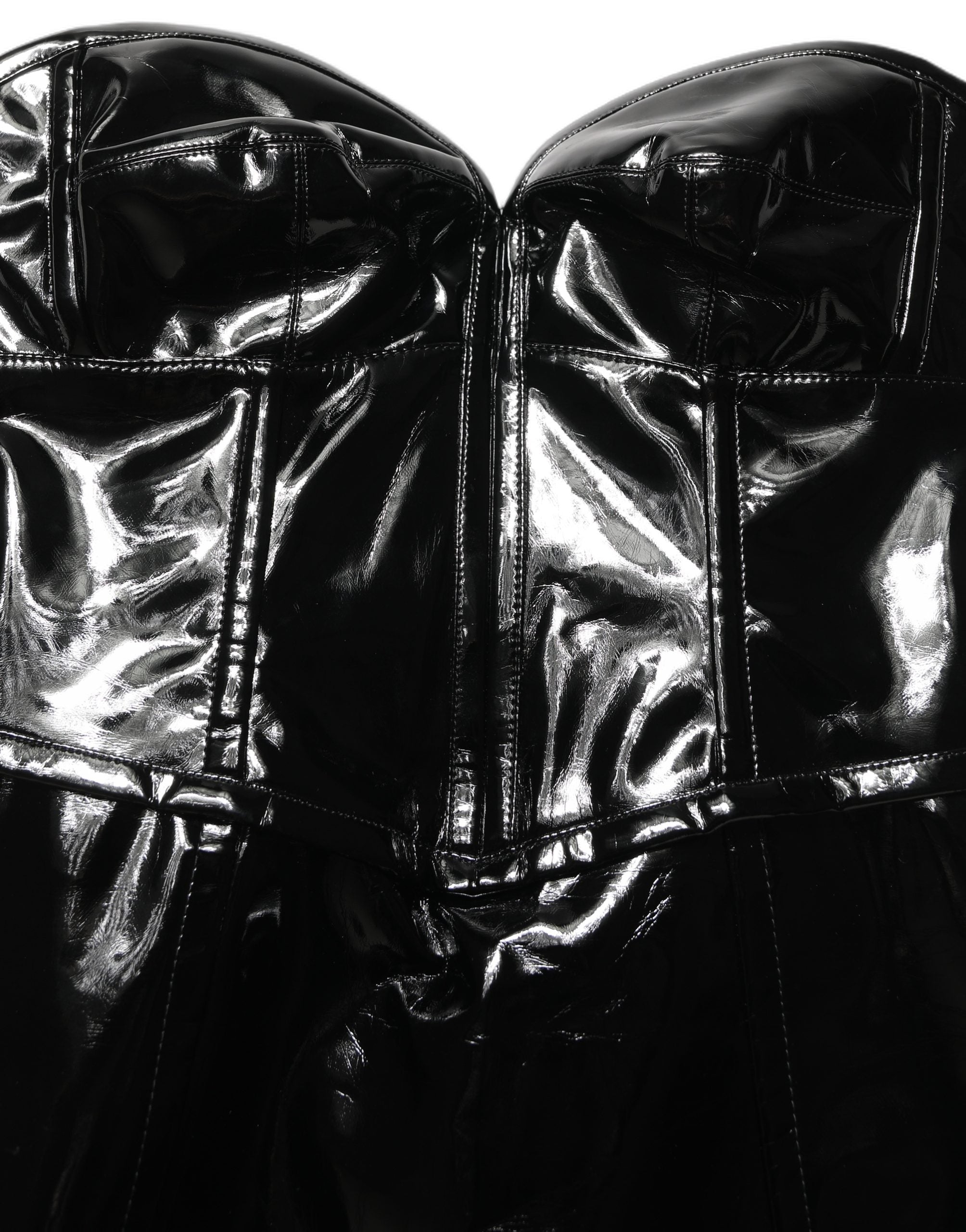 Indulge in the exquisite allure of the Dolce & Gabbana Black Patent Leather Corset Style Mini Dress, a masterpiece of Italian craftsmanship that embodies ultimate luxury and sophistication.