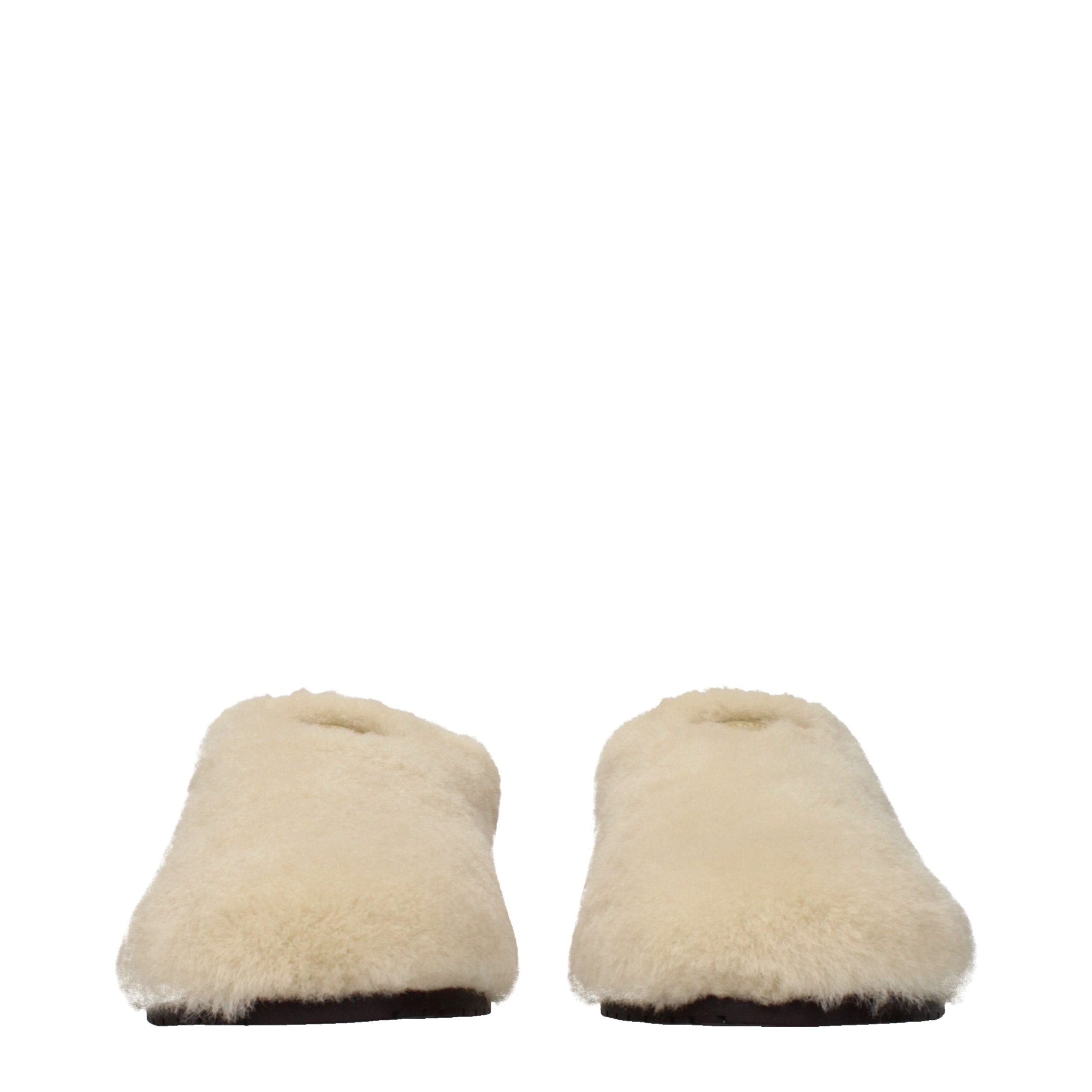 Indulge in the exquisite allure of Prada Beige Fur Slippers, where artisanal craftsmanship meets luxurious comfort, elevating your elegance with timeless sophistication.