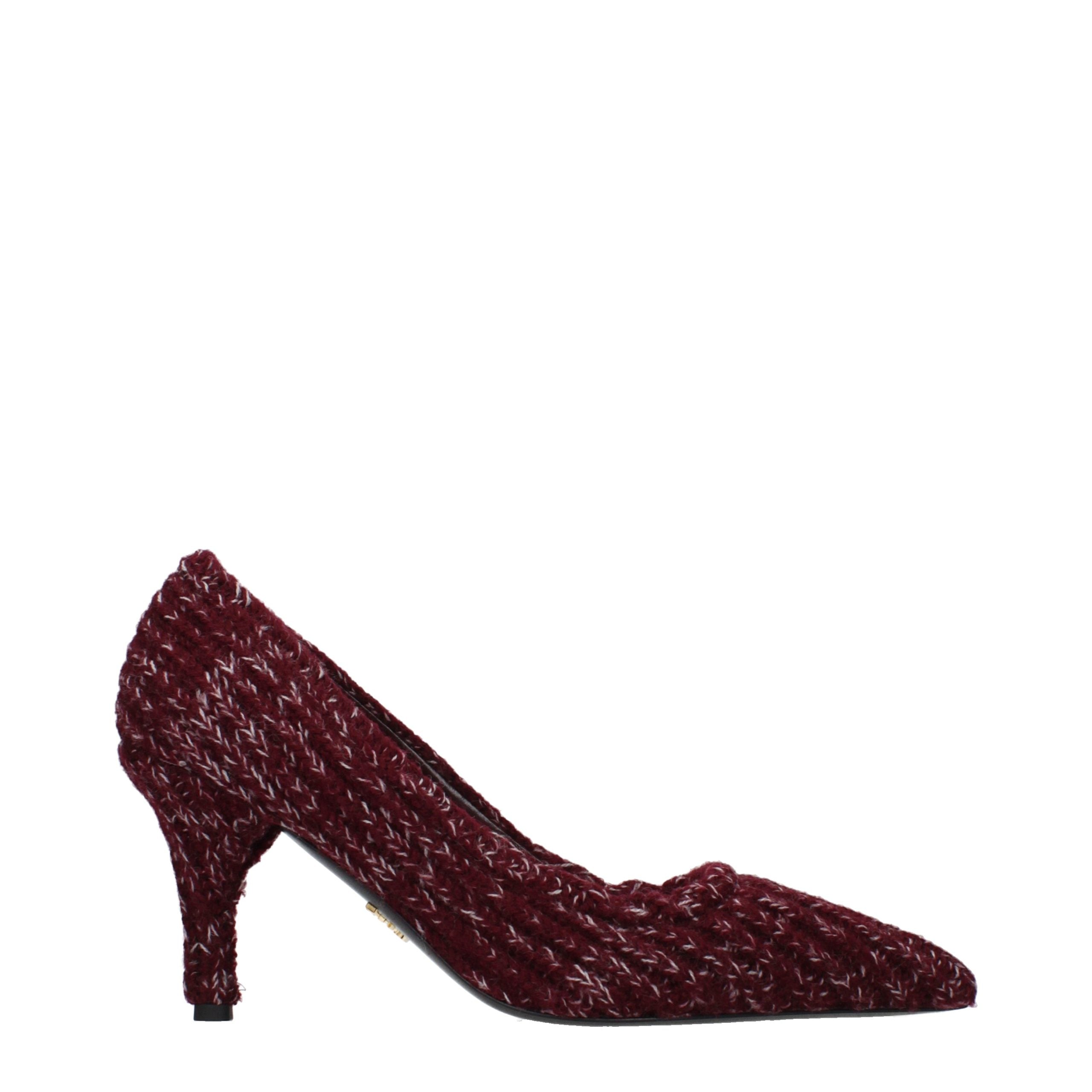 Step into a realm of elegance with Prada's Red Fabric Mid Heel Pumps, where exquisite craftsmanship meets luxurious design, perfect for the sophisticated individual.
