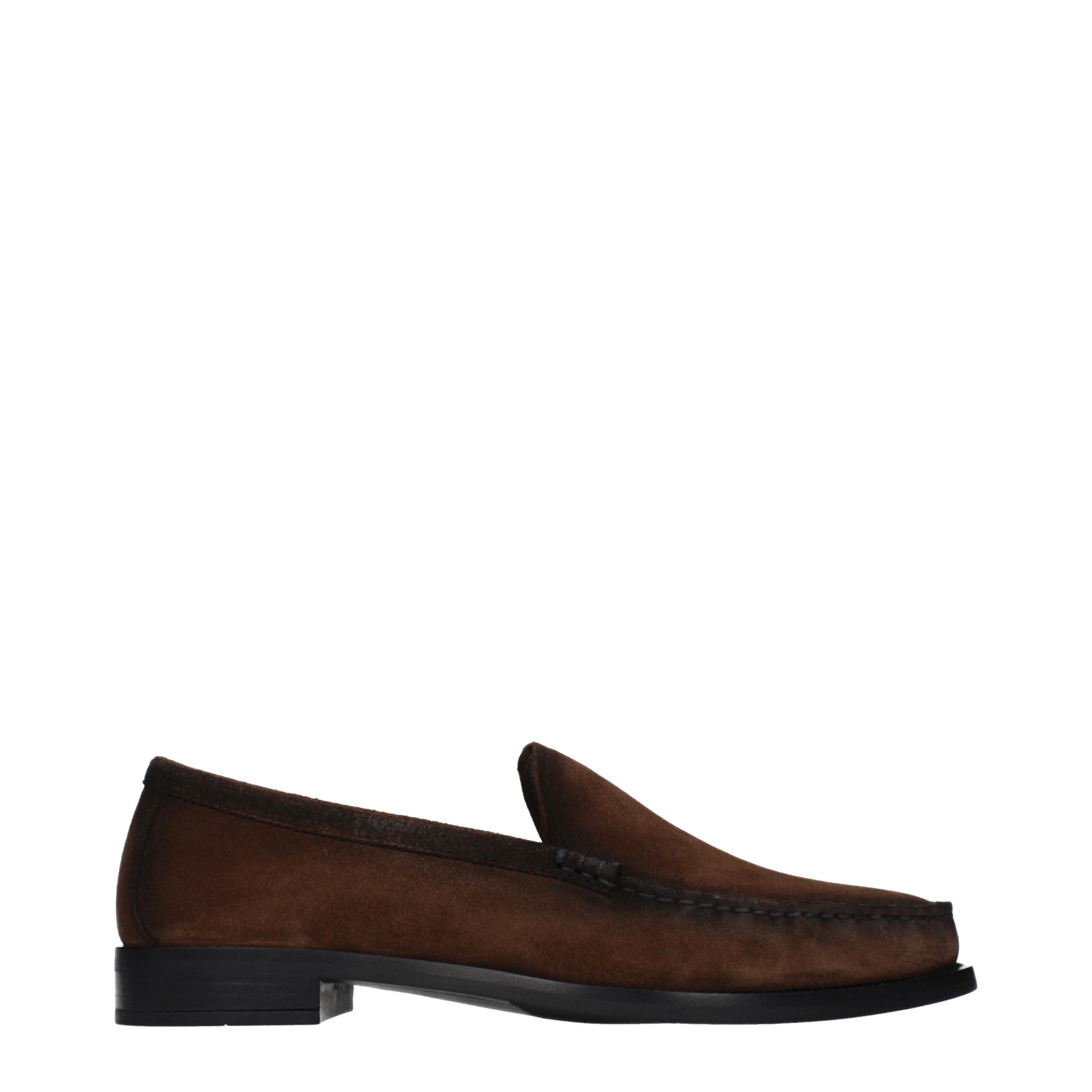 Experience the allure of Prada's Brown Leather Slip-On Loafers, where artisanal craftsmanship meets timeless elegance, perfect for the discerning connoisseur.