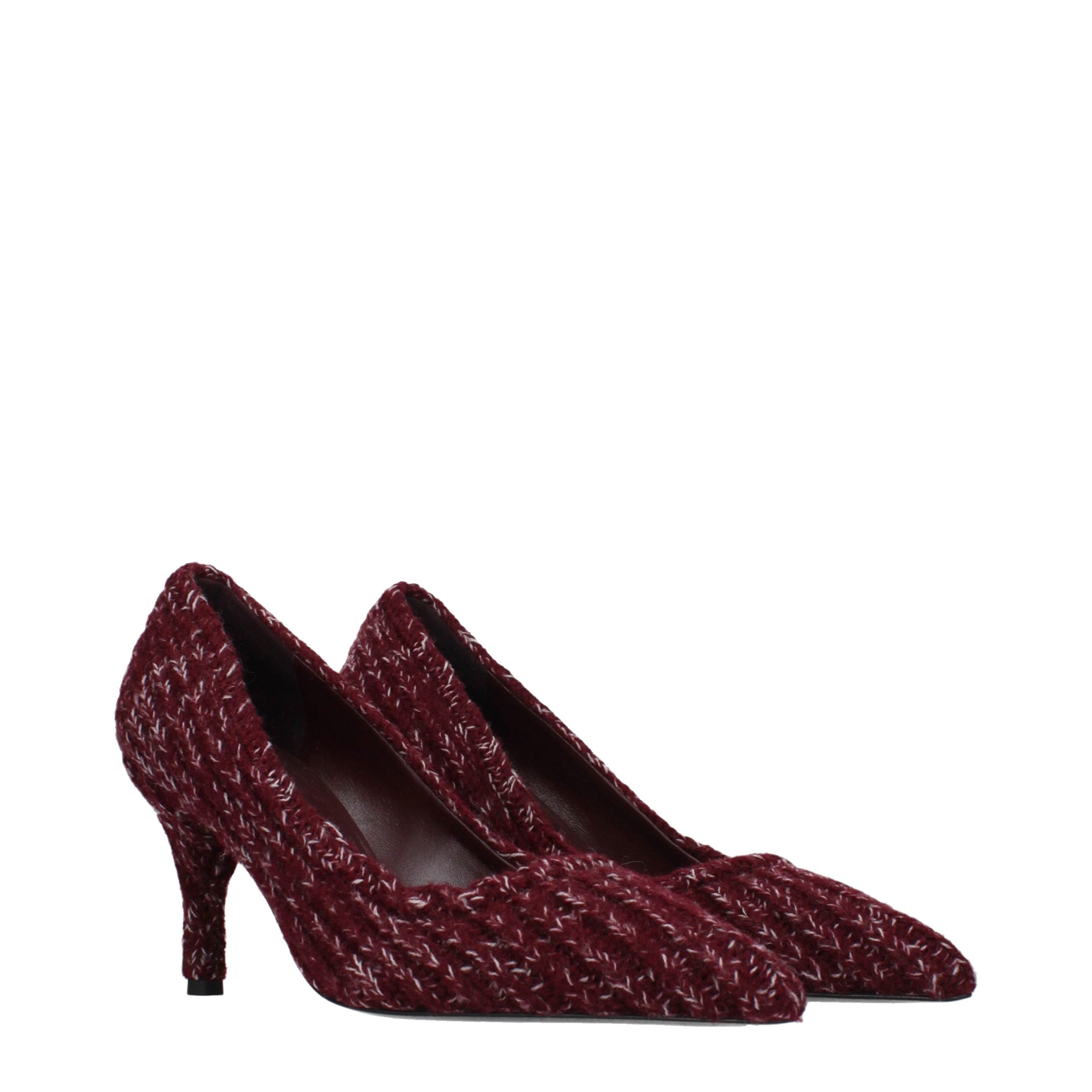 Indulge in the exquisite allure of Prada's Red Fabric Mid Heel Pumps, where artisanal craftsmanship meets timeless elegance, perfect for any sophisticated occasion.