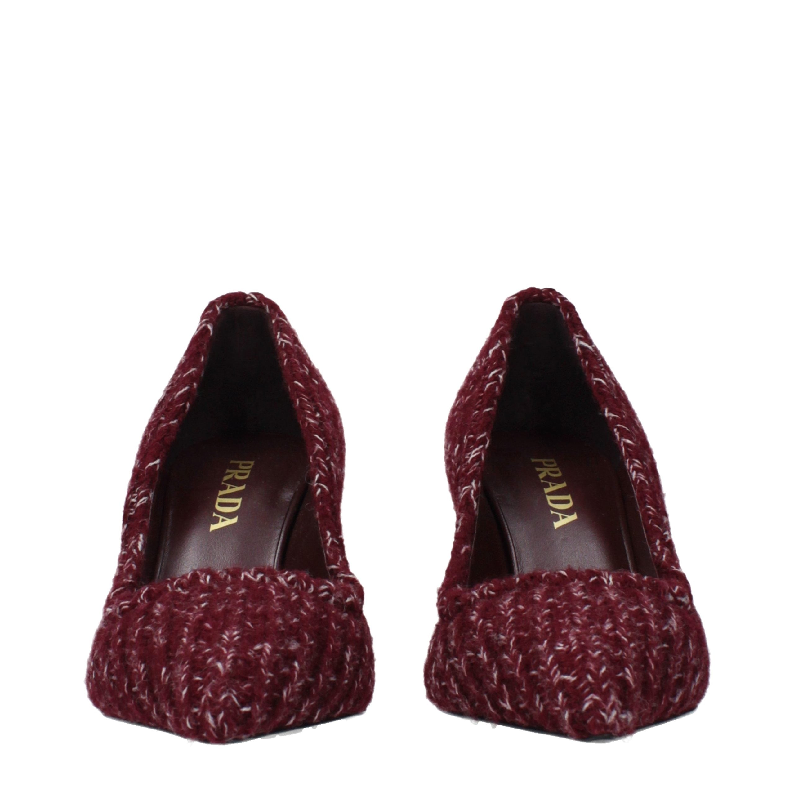 Elevate your elegance with Prada's Red Fabric Mid Heel Pumps, a testament to exquisite craftsmanship and luxurious design, perfect for any sophisticated occasion.