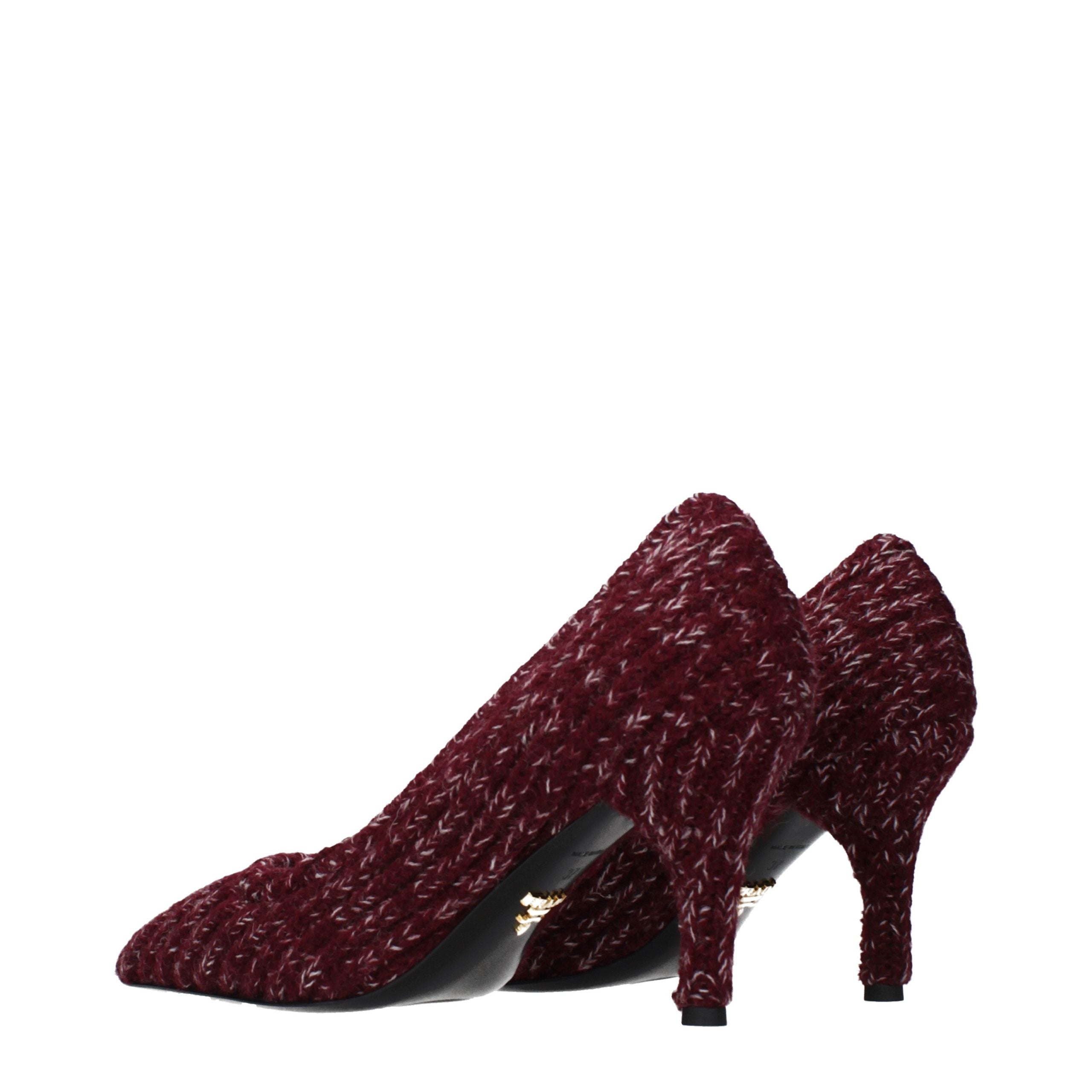 Elevate your elegance with Prada's Red Fabric Mid Heel Pumps, a masterpiece of artisanal craftsmanship that embodies luxury and sophistication for any occasion.