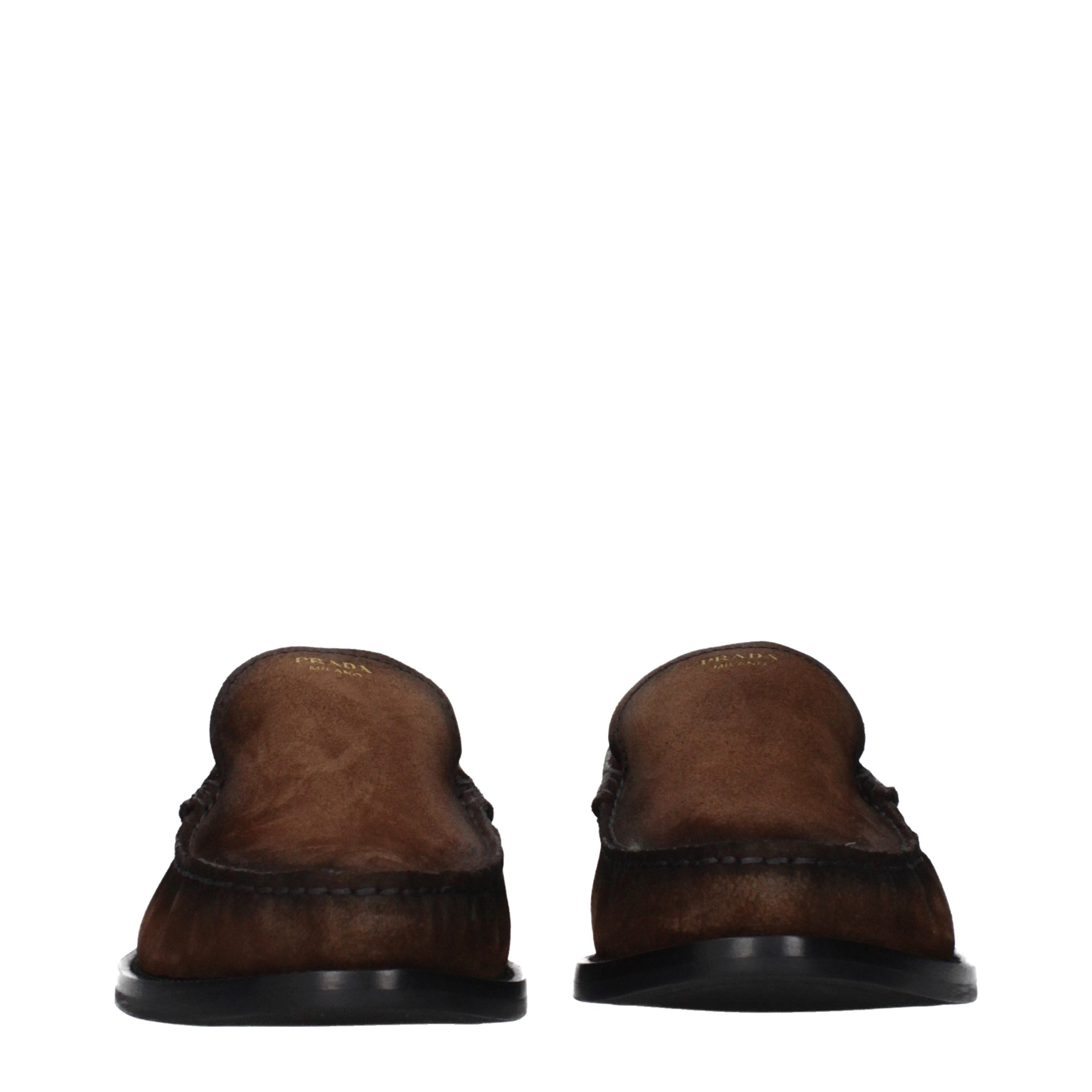Step into a realm of sophistication with Prada's Brown Leather Slip-On Loafers, where artisanal craftsmanship meets timeless elegance, perfect for the discerning connoisseur.