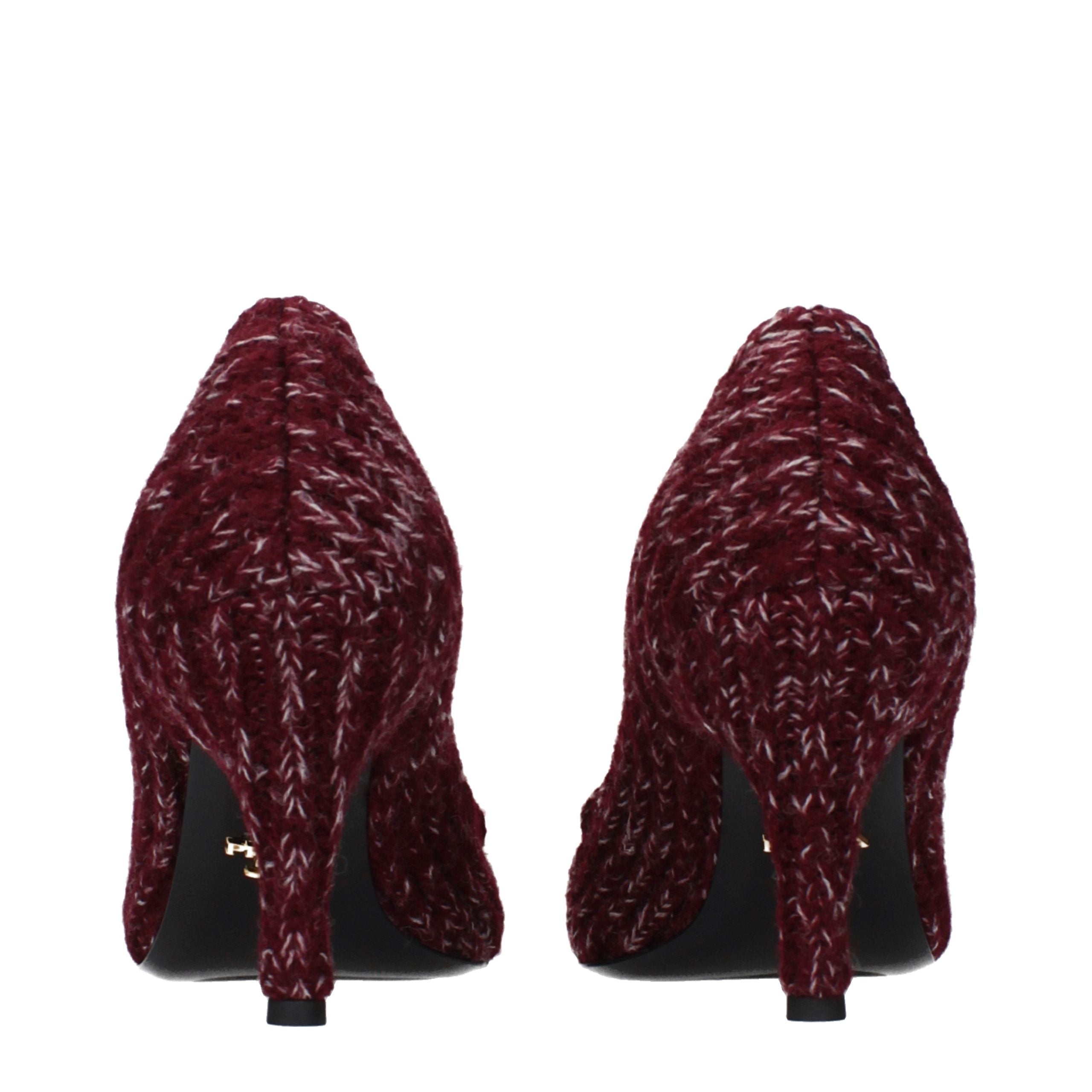 Step into a world of refined elegance with Prada's Red Fabric Mid Heel Pumps, a luxurious blend of artisanal craftsmanship and timeless sophistication.