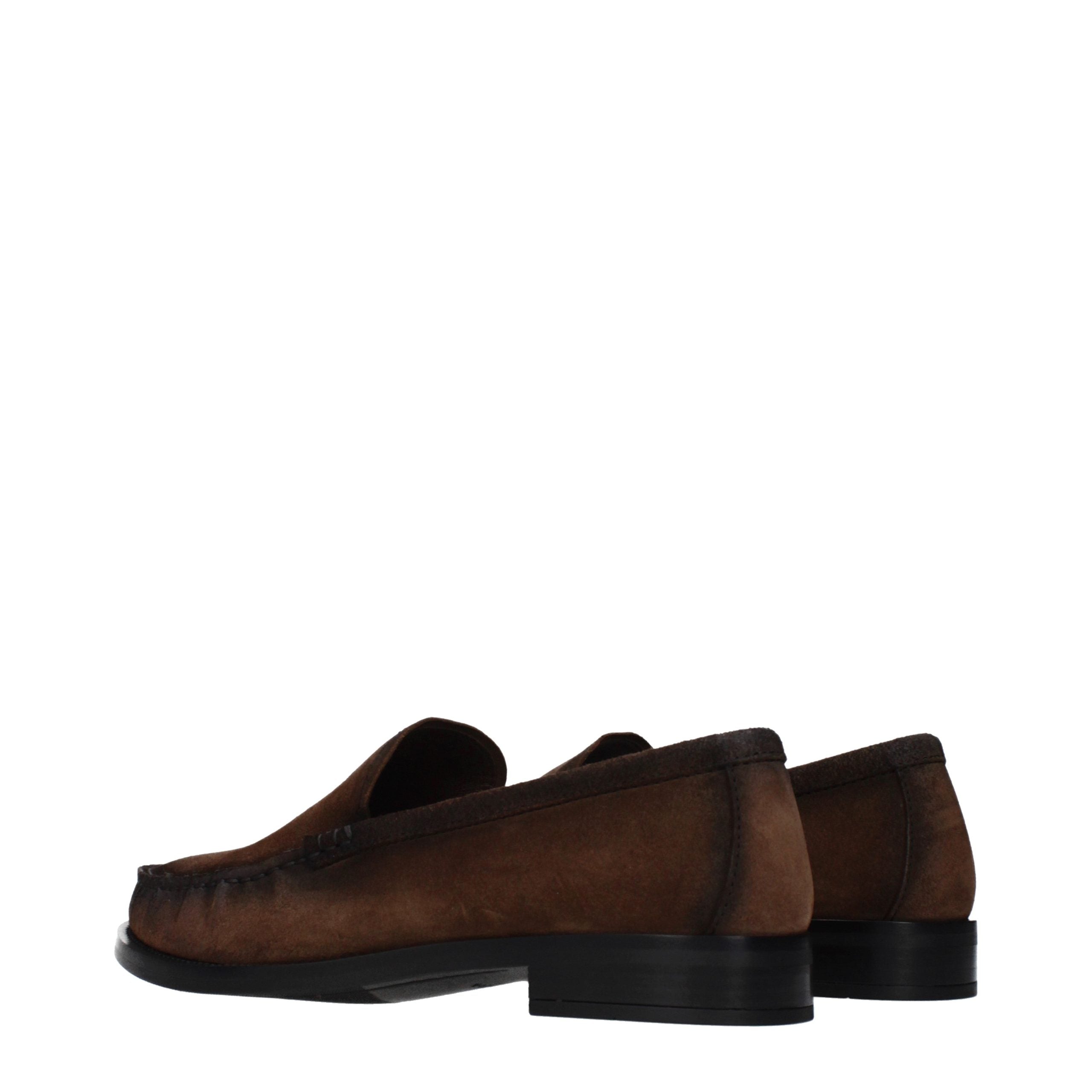 Experience the timeless elegance of Prada Brown Leather Slip-On Loafers, where artisanal craftsmanship meets luxurious comfort, perfect for the discerning connoisseur.