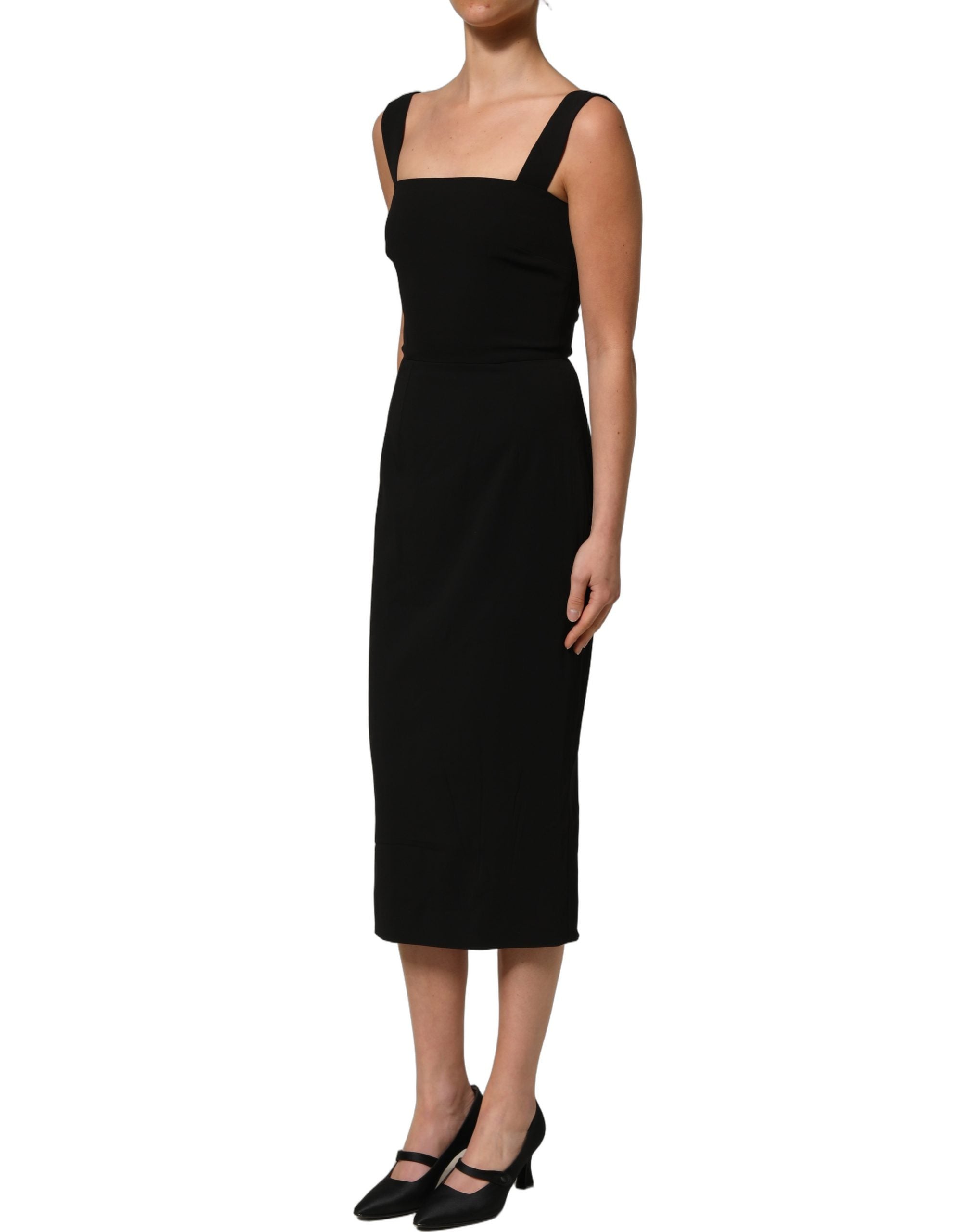 Experience the allure of Dolce & Gabbana's Black Viscose Stretch Sheath Midi Dress, a masterpiece of Italian craftsmanship that embodies timeless elegance and sophistication.