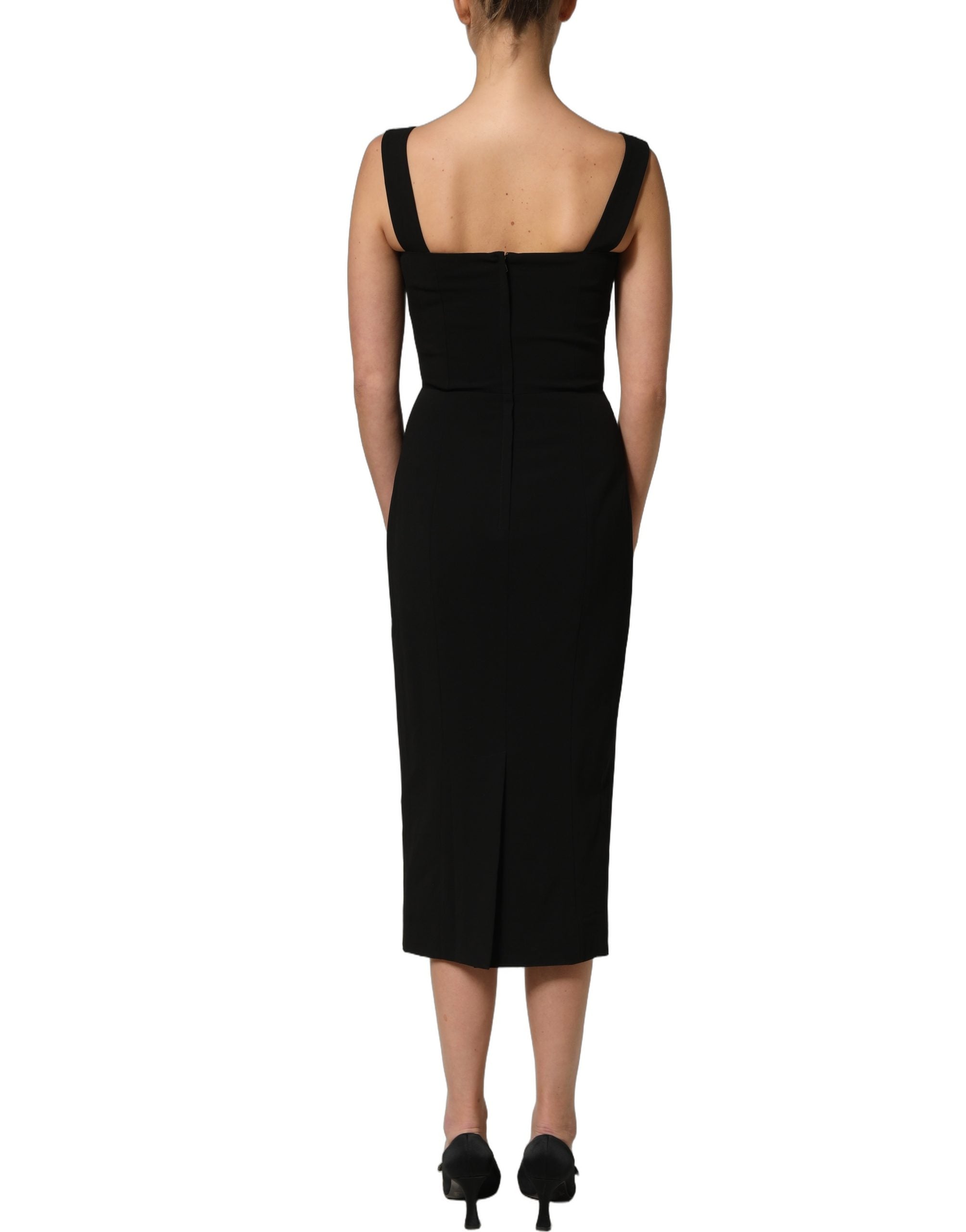 Experience the allure of Dolce & Gabbana's Black Viscose Stretch Sheath Midi Dress, a masterpiece of Italian craftsmanship that embodies timeless elegance and sophistication.
