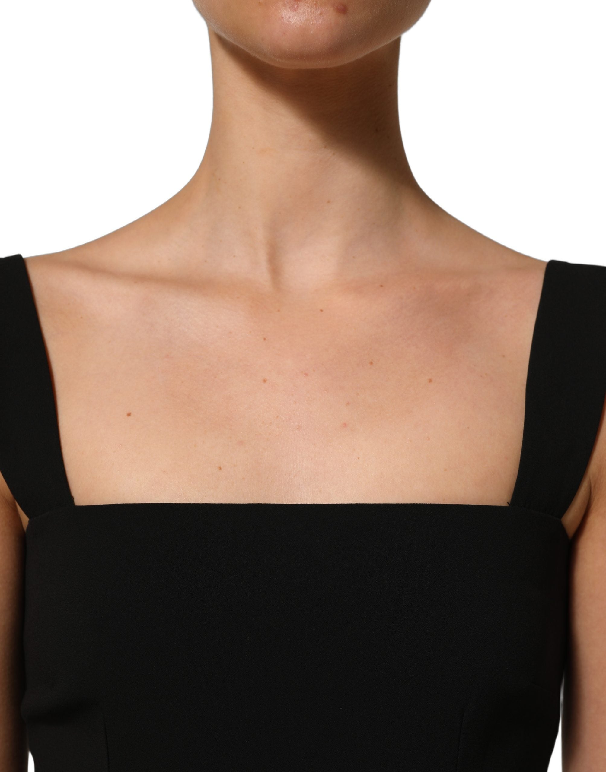 Experience the allure of the Dolce & Gabbana Black Viscose Stretch Sheath Midi Dress, a testament to Italian craftsmanship that elevates your elegance for any occasion.