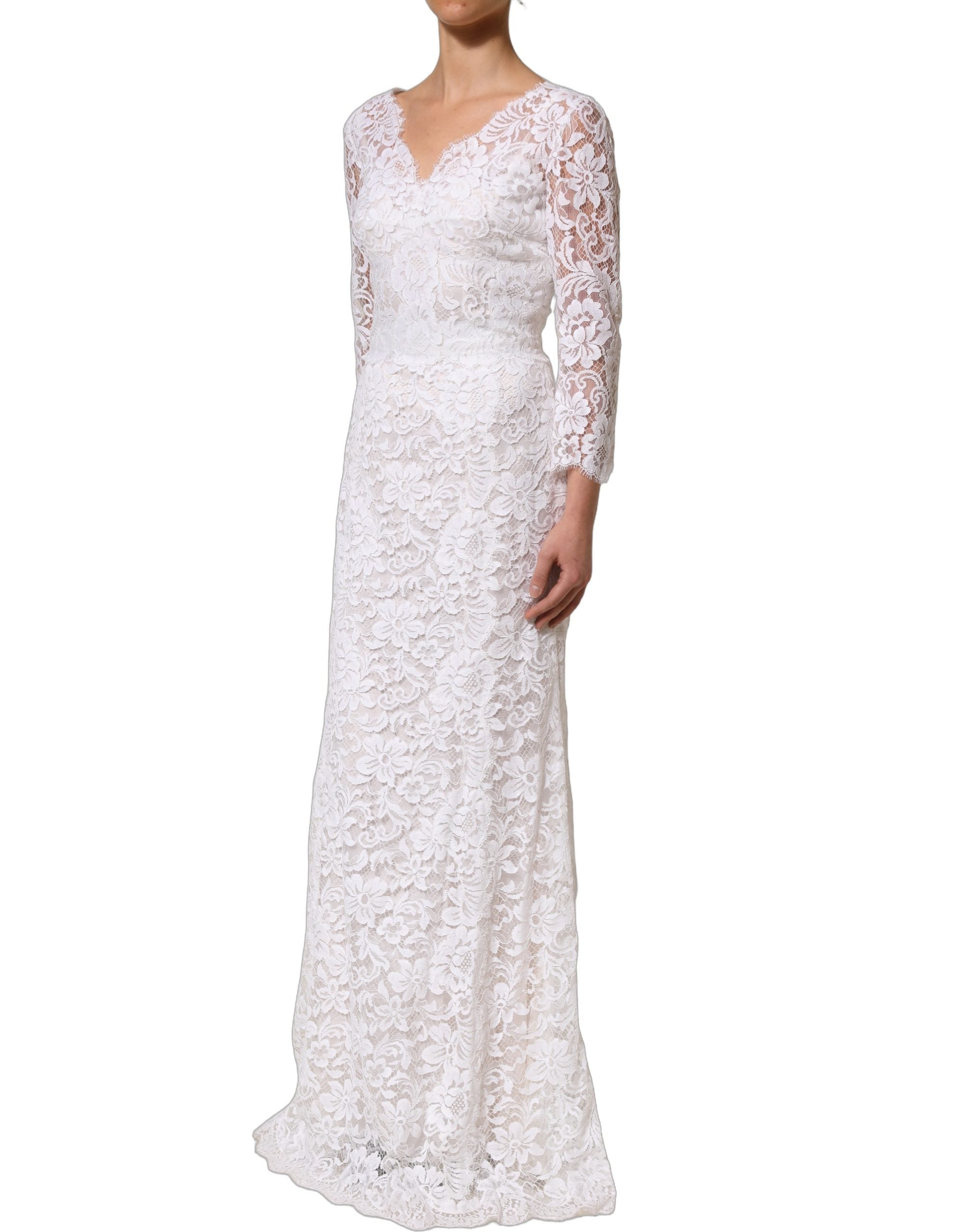 Indulge in the exquisite allure of the Dolce & Gabbana White Cotton Floral Lace Long Gown, a masterpiece of Italian craftsmanship that embodies timeless elegance and sophistication.