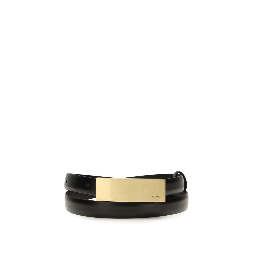 Discover the Khaite Black Calf Leather Bos Taurus Regular Belt, a masterpiece of Italian craftsmanship that elevates your style with its sculptural elegance and luxurious finish.