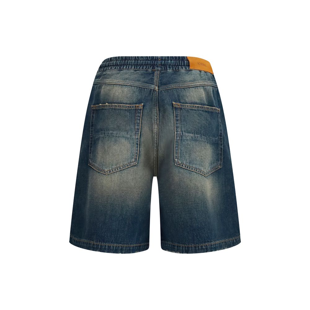 Discover the Amiri Blue Cotton Bermuda Shorts, a masterclass in luxury and craftsmanship, blending effortless style with a sun-faded allure for the discerning individual.