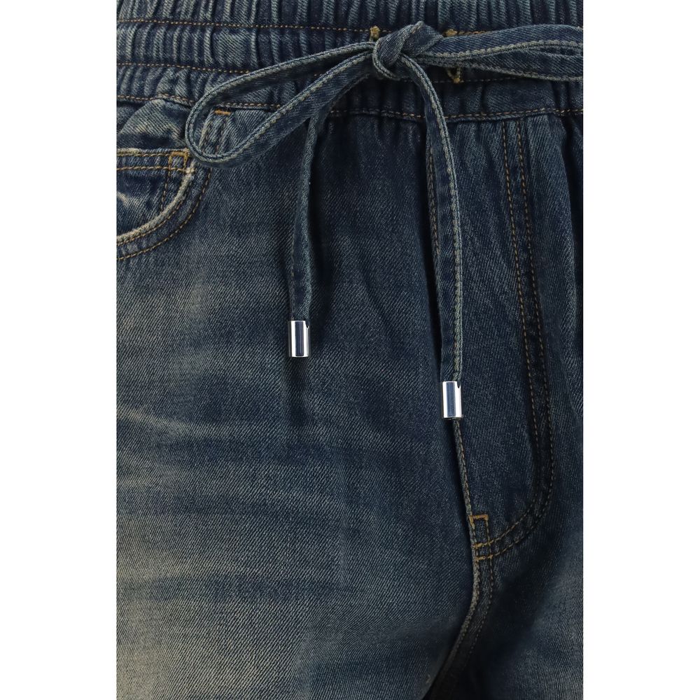 Elevate your wardrobe with Amiri Blue Cotton Bermuda Shorts, crafted from premium cotton with a sun-faded effect, embodying modern luxury and effortless sophistication.