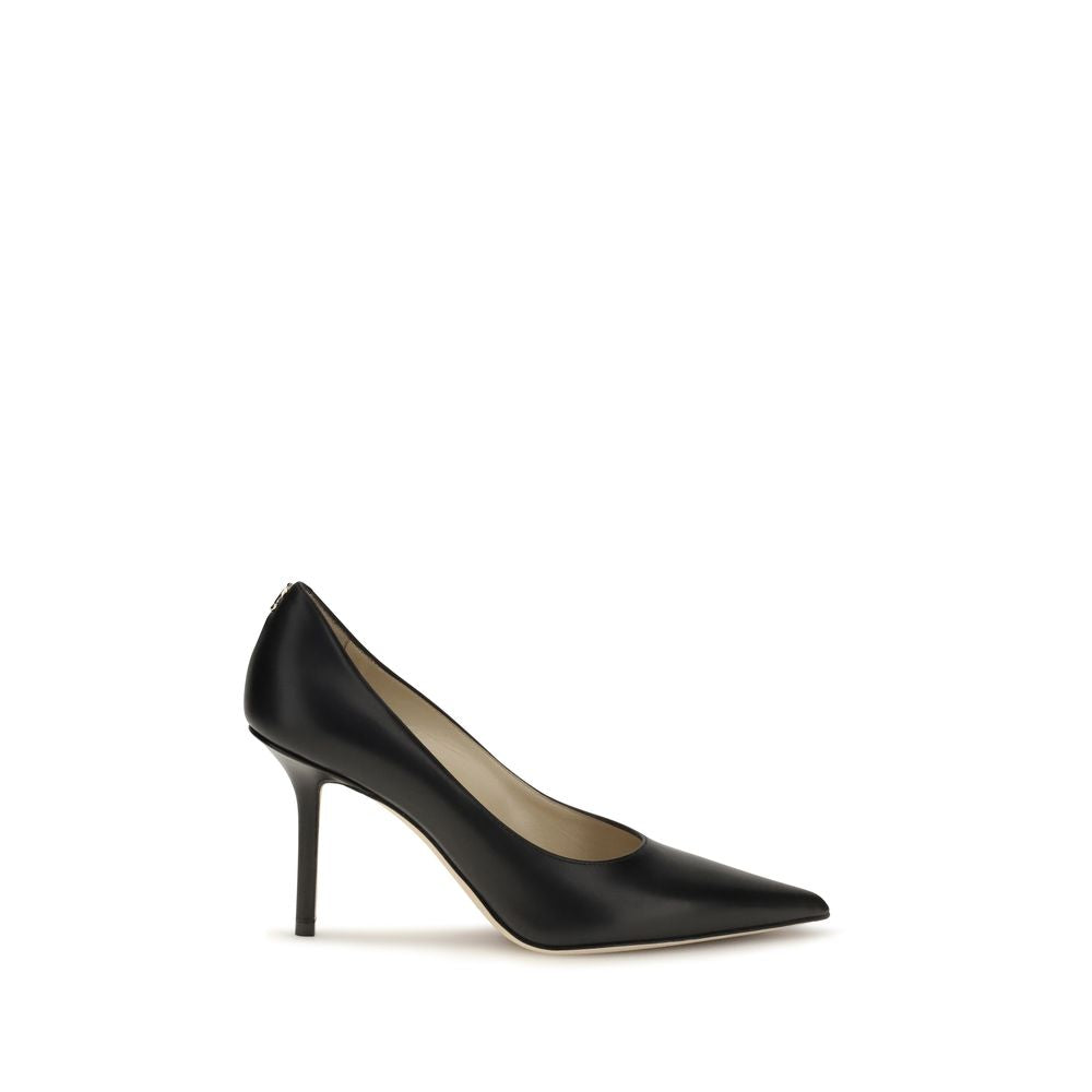 Elevate your elegance with Jimmy Choo's Black Calf Leather Bos Taurus High Heel Pumps, handcrafted in Italy for timeless sophistication and allure.