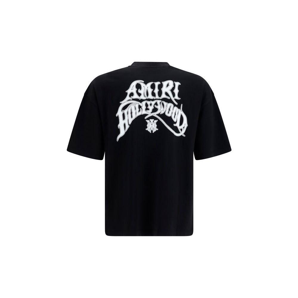 Elevate your wardrobe with the Amiri Black Cotton T-Shirt, a luxurious essential crafted from 100% cotton, embodying refined sophistication and timeless style.